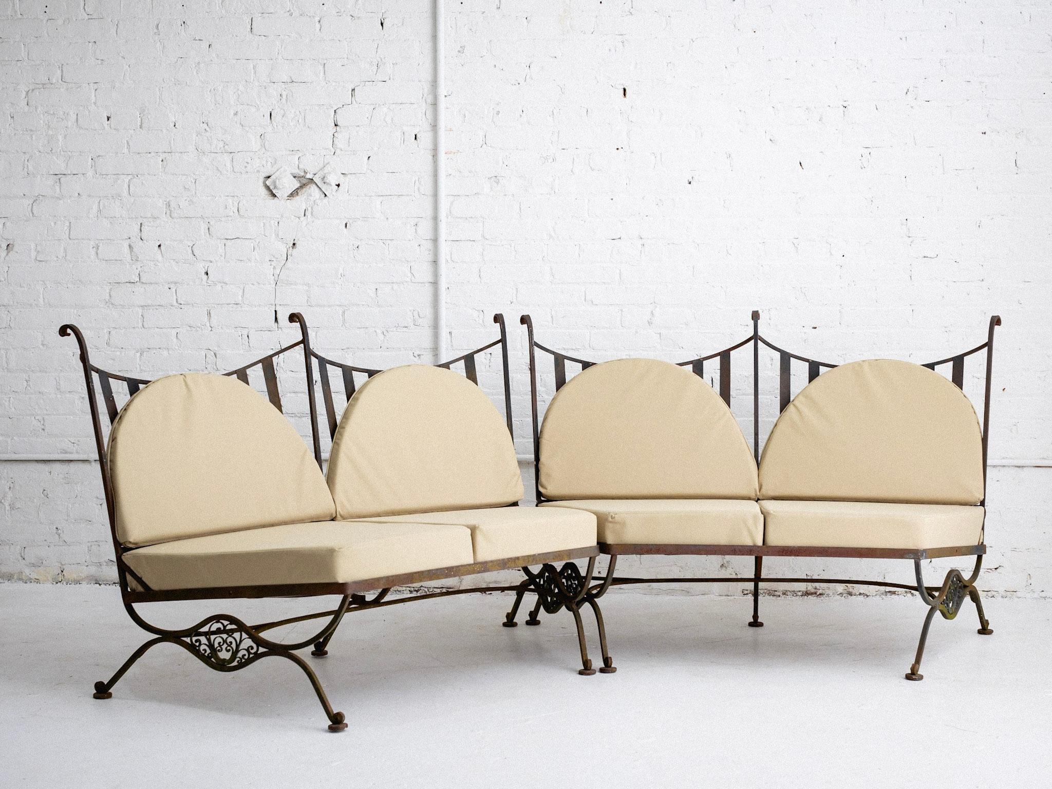 A mid century outdoor 2 piece sectional attributed to John Salterini. Wrought iron frames and newly upholstered cushions in outdoor suitable canvas and foam. Natural patina as found. Sold as a set.
