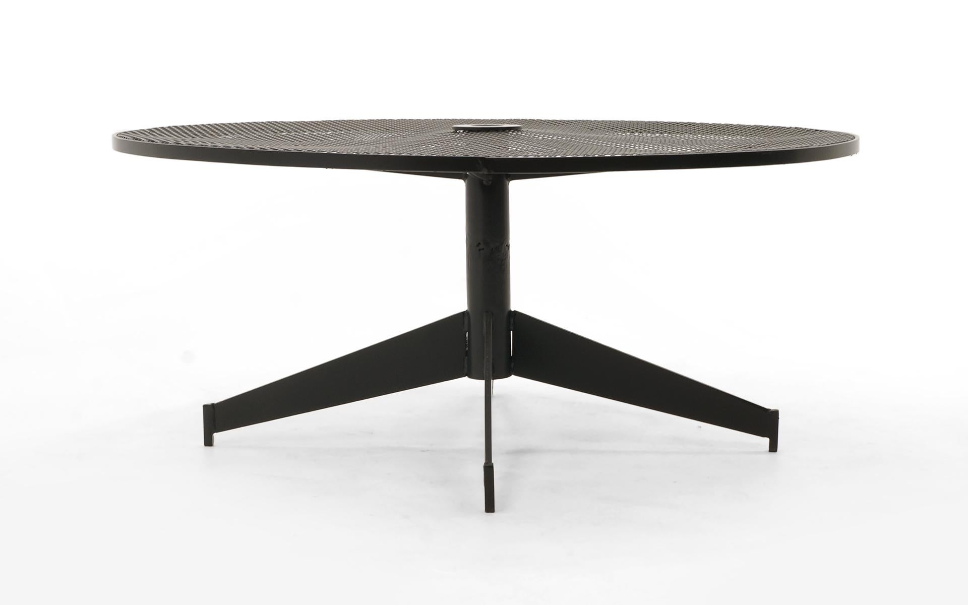 Patio or POOL or outdoor coffee table by the John Salterini company, 1960s. The center has an opening for an umbrella. This has been expertly media blasted and powder coated. The tabletop shows some indentations in the top, but no major distraction.