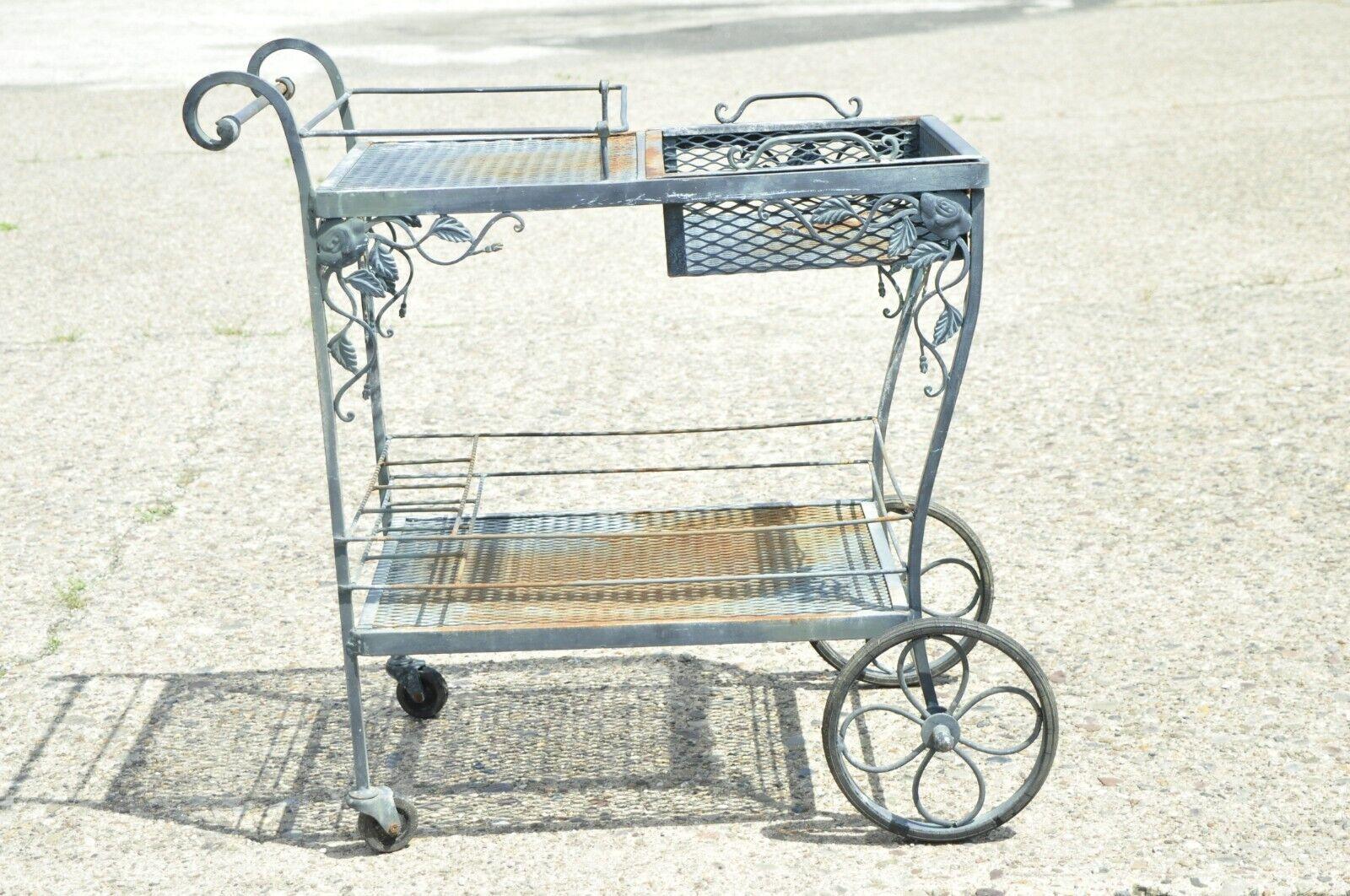 John Salterini Wrought Iron Green Garden Leaf Vine Bar Tea Cart Server. Item features rolling wheels, ornate leaf and vine design, lift out serving tray, wrought iron construction, very nice vintage item, great style and form. Circa Early to Mid