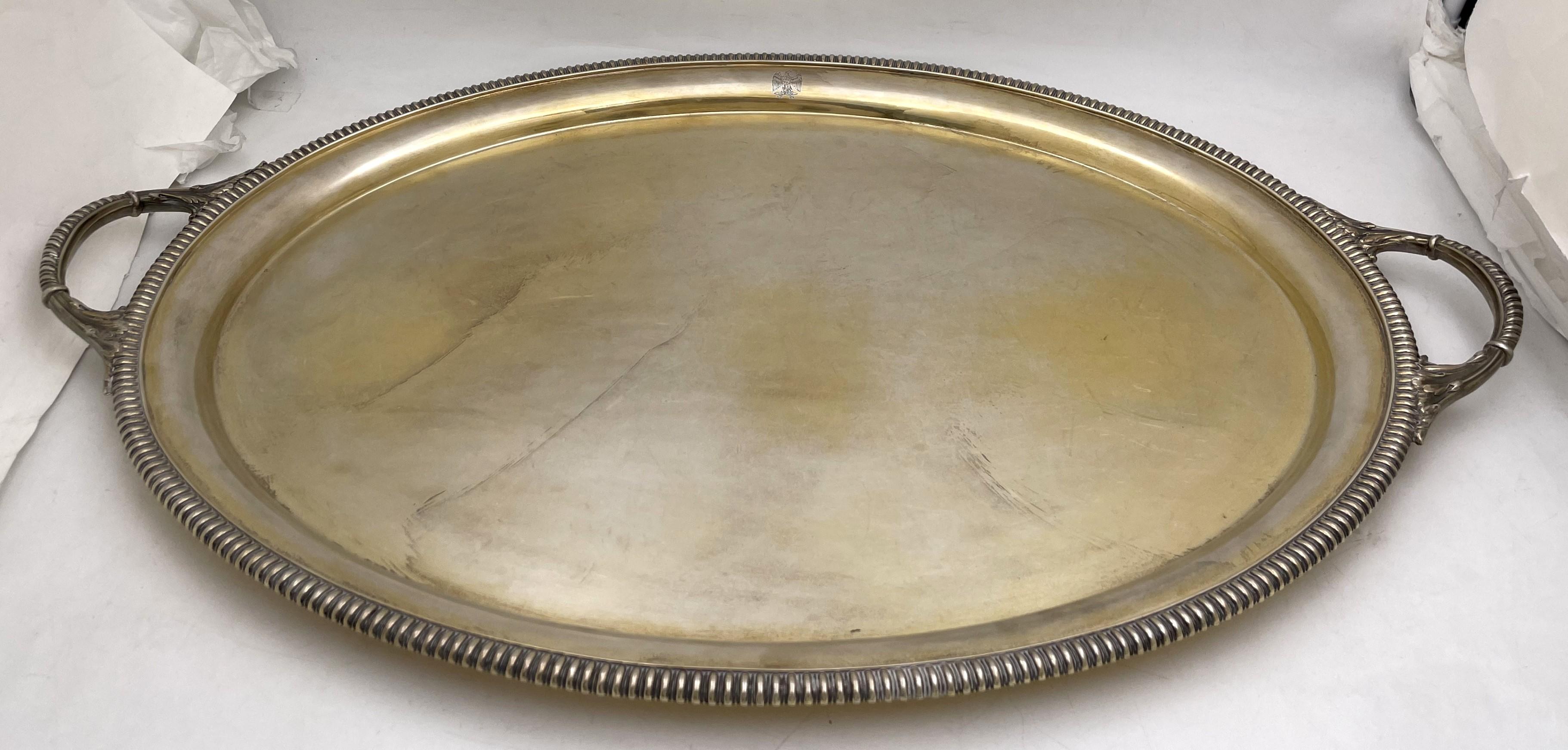 John Spink, Irish gilt sterling silver two-handled tray from 1939 with a gadrooned rim, an eagle motif, and in an elegant design reminiscent of the Regency style. It measures 27 1/2'' from handle to handle (24'' excluding the handles) by 18'' in