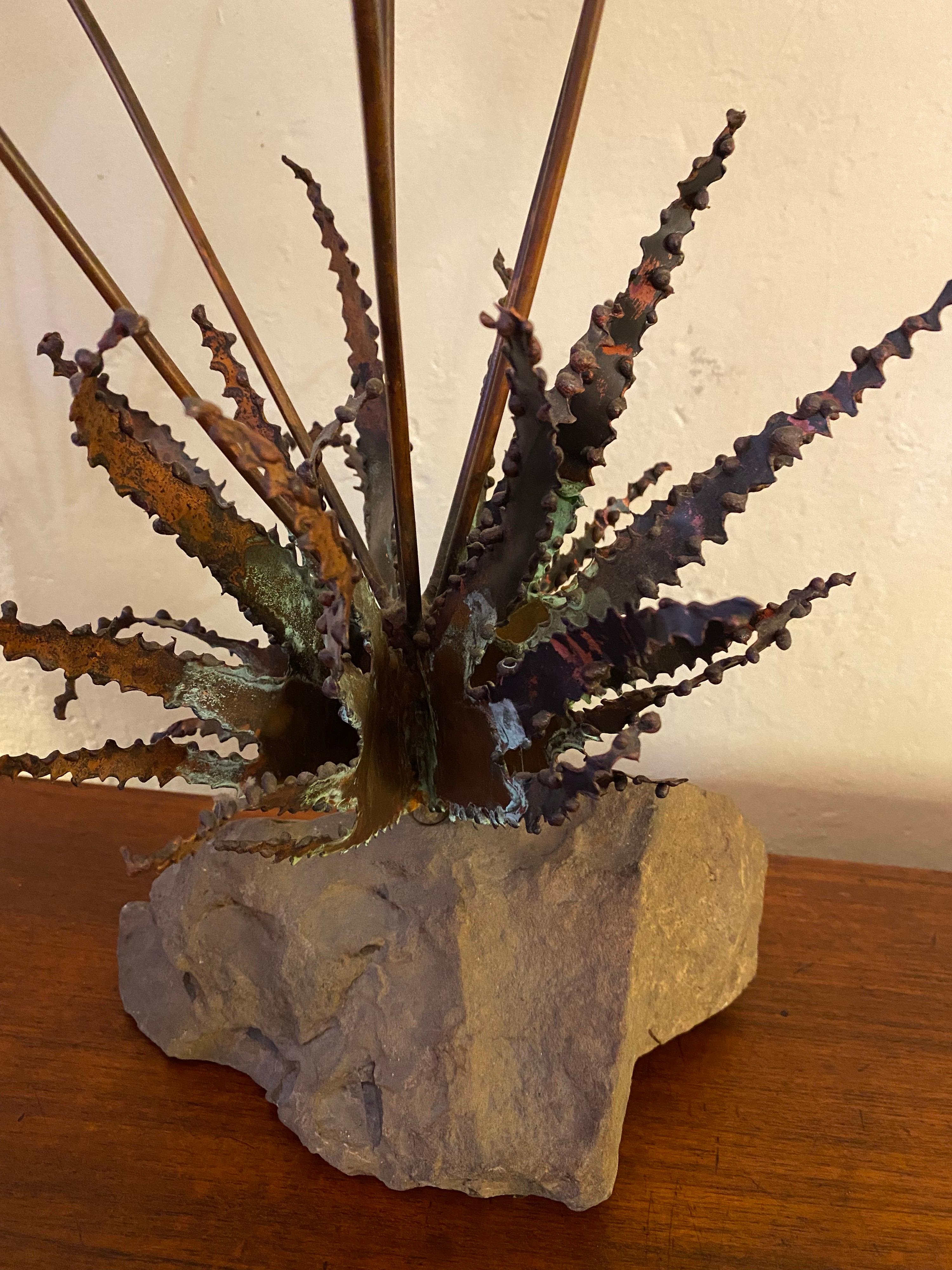 John Steck copper and stone Desert floral sculpture would complement any mid-century modern credenza or dresser.