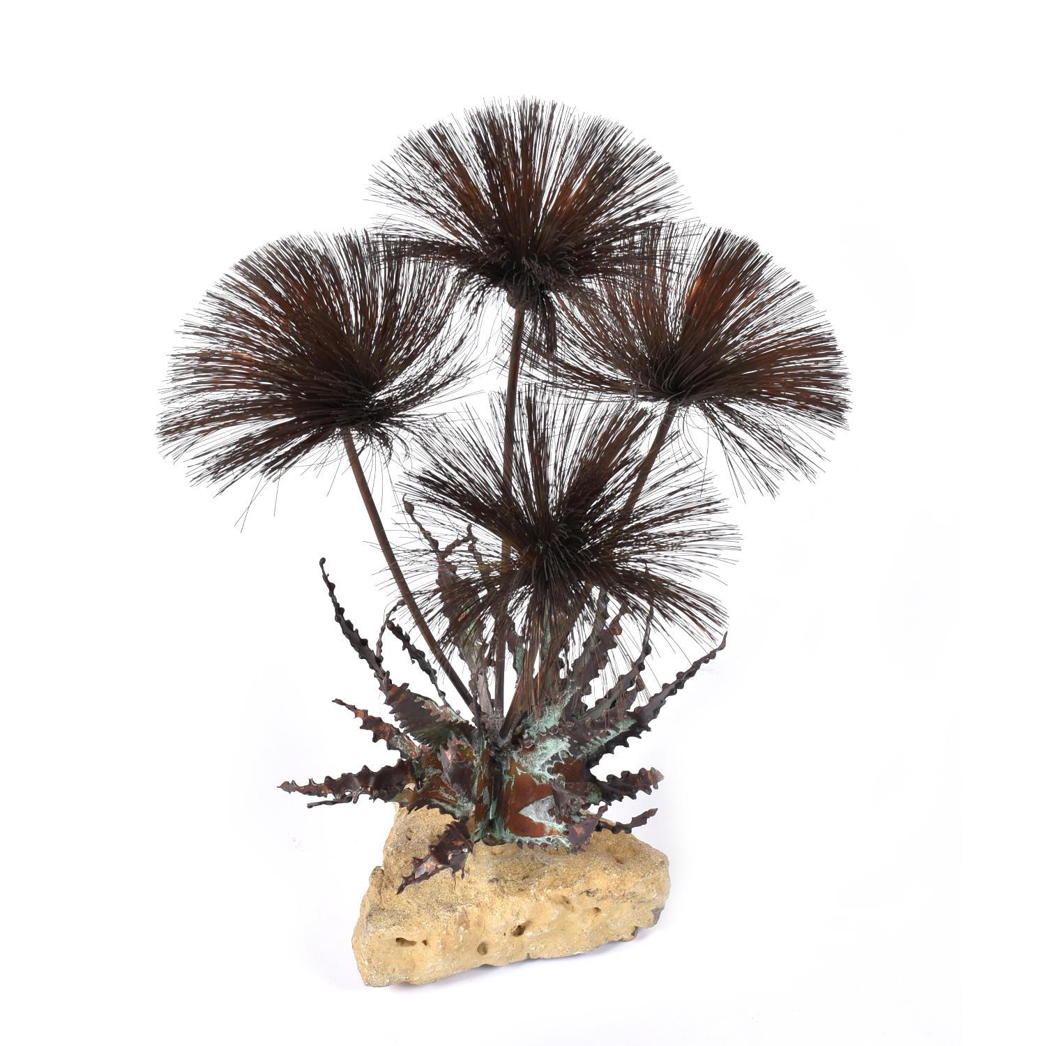 Vintage 1960s metal and stone table top sculpture. “Desert Rose” by John Steck is a timeless floral arrangement of bristly pom-pom blooms emanating from a stone base. The botanical aspects are all made of copper and brass. The flower heads are made