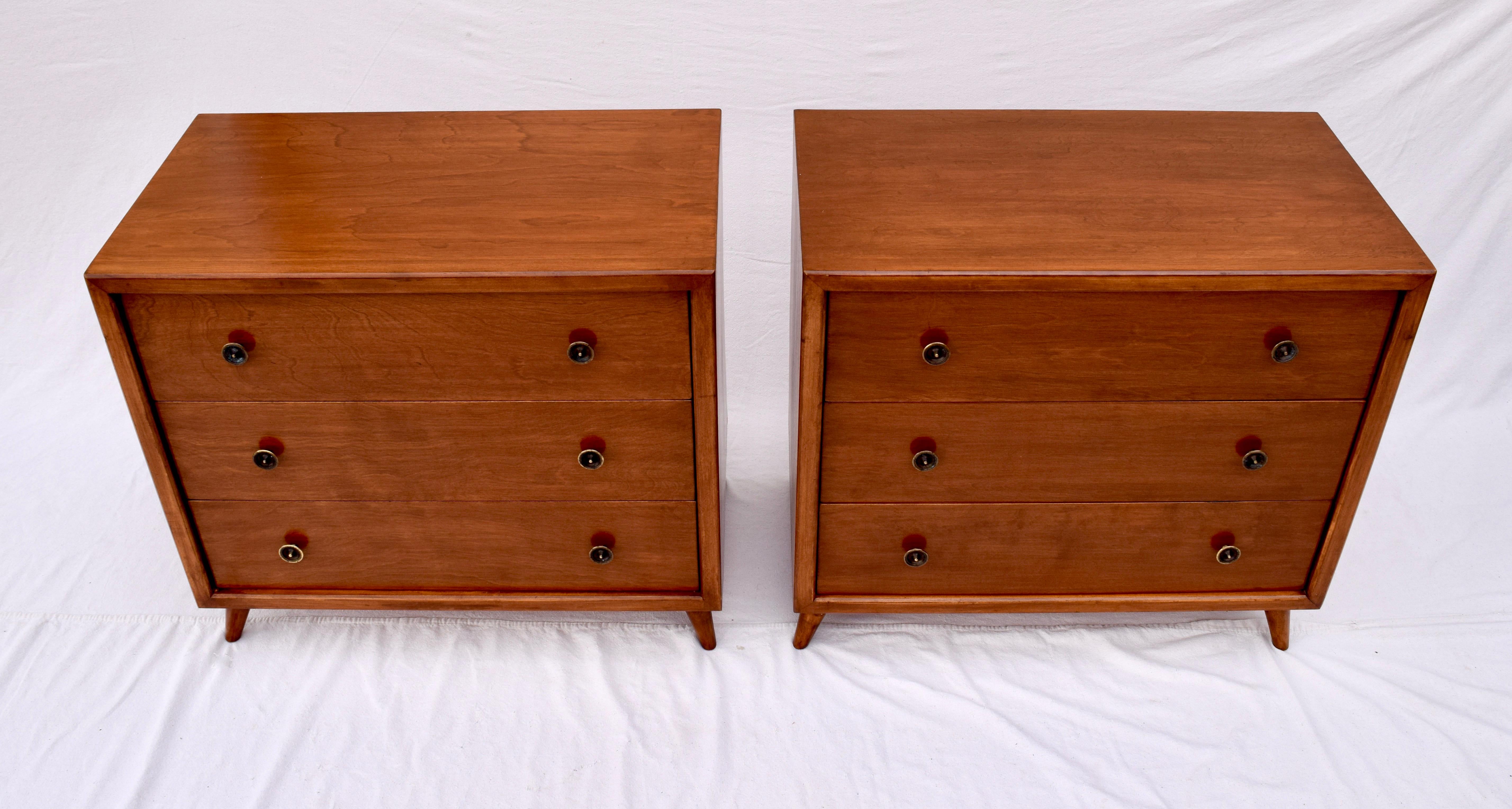 A pair of 1950s John Stuart Bachelor three-drawer chests with flared and tapered legs. Generous in size, each chest retains its' John Stuart metal tag.
Newly refinished.