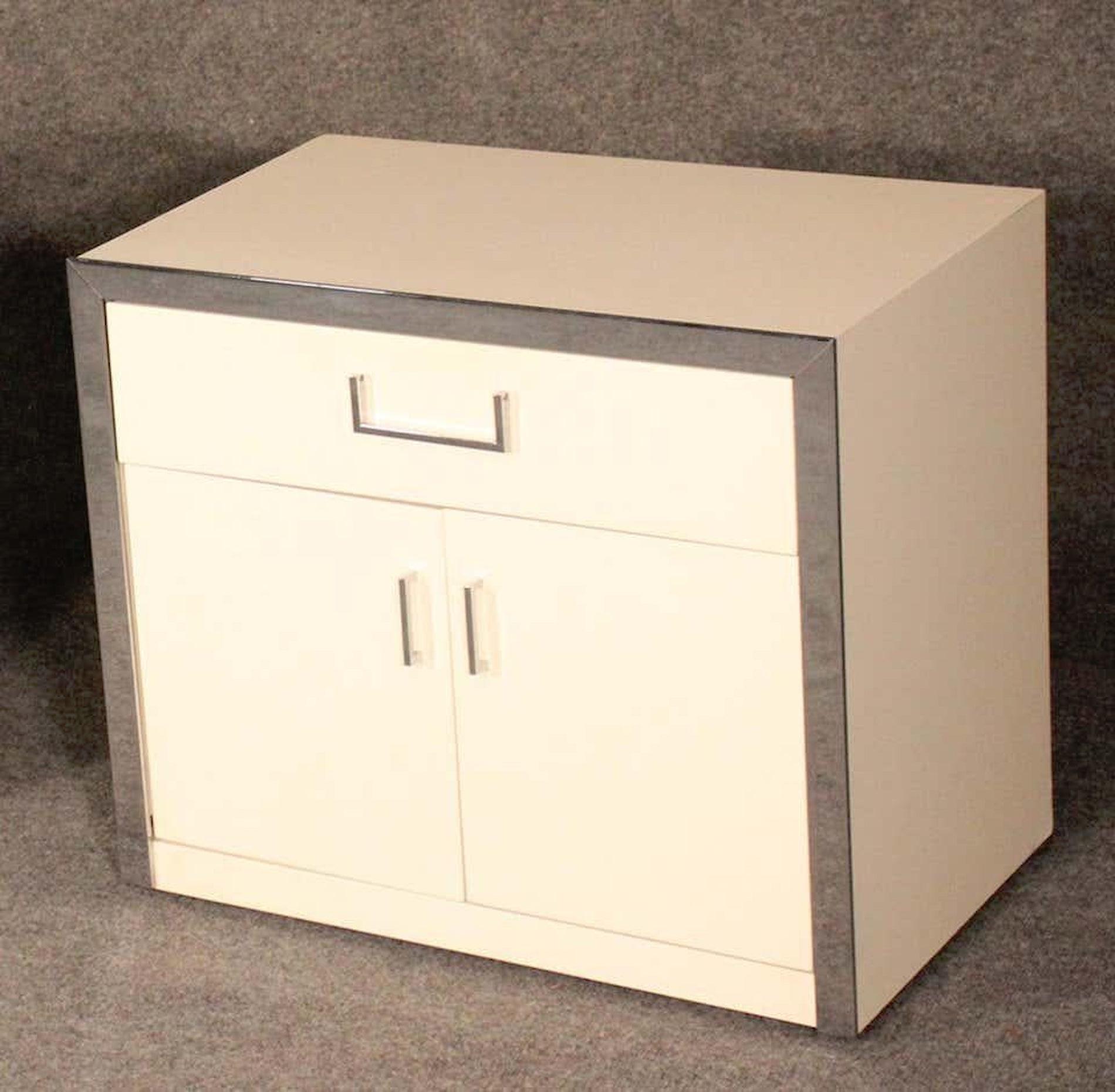 Mid-Century Modern nightstands in white with polished chrome hardware.
(Please confirm item location - NY or NJ - with dealer).
    