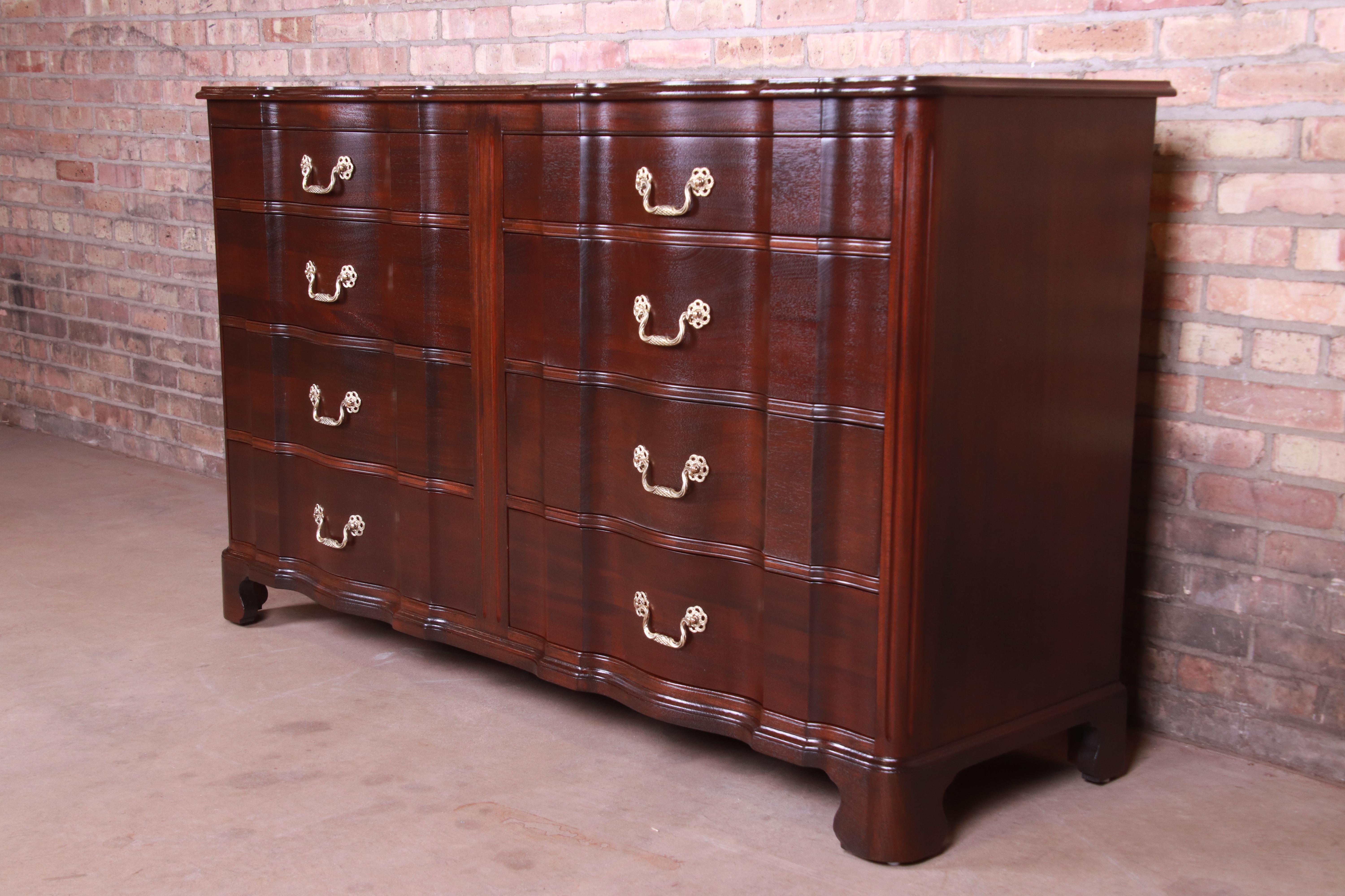 A gorgeous English Chippendale style double dresser or credenza.

By John Stuart,

USA, circa 1950s

Mahogany, with original brass hardware.

Measures: 61.5