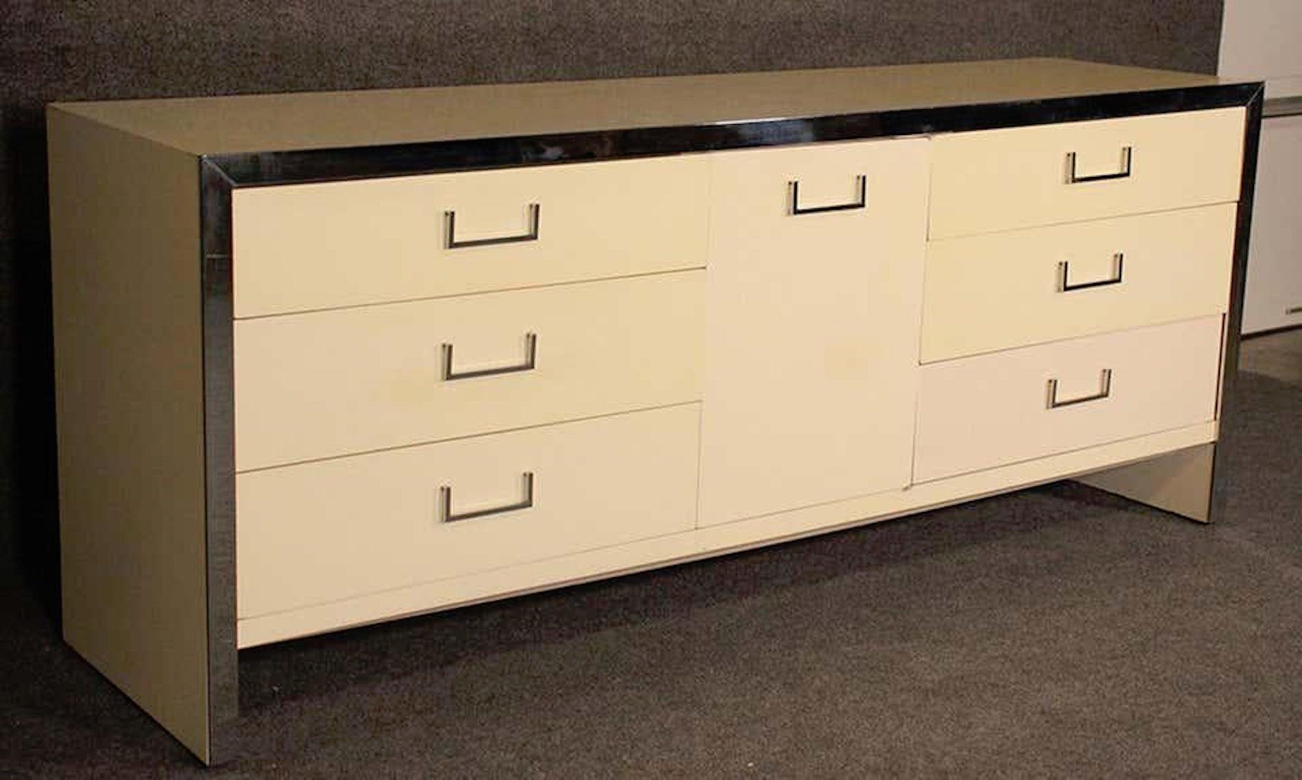 Mid-Century Modern nine-drawer dresser in off white with polished chrome hardware.
(Please confirm item location - NY or NJ - with dealer).
  