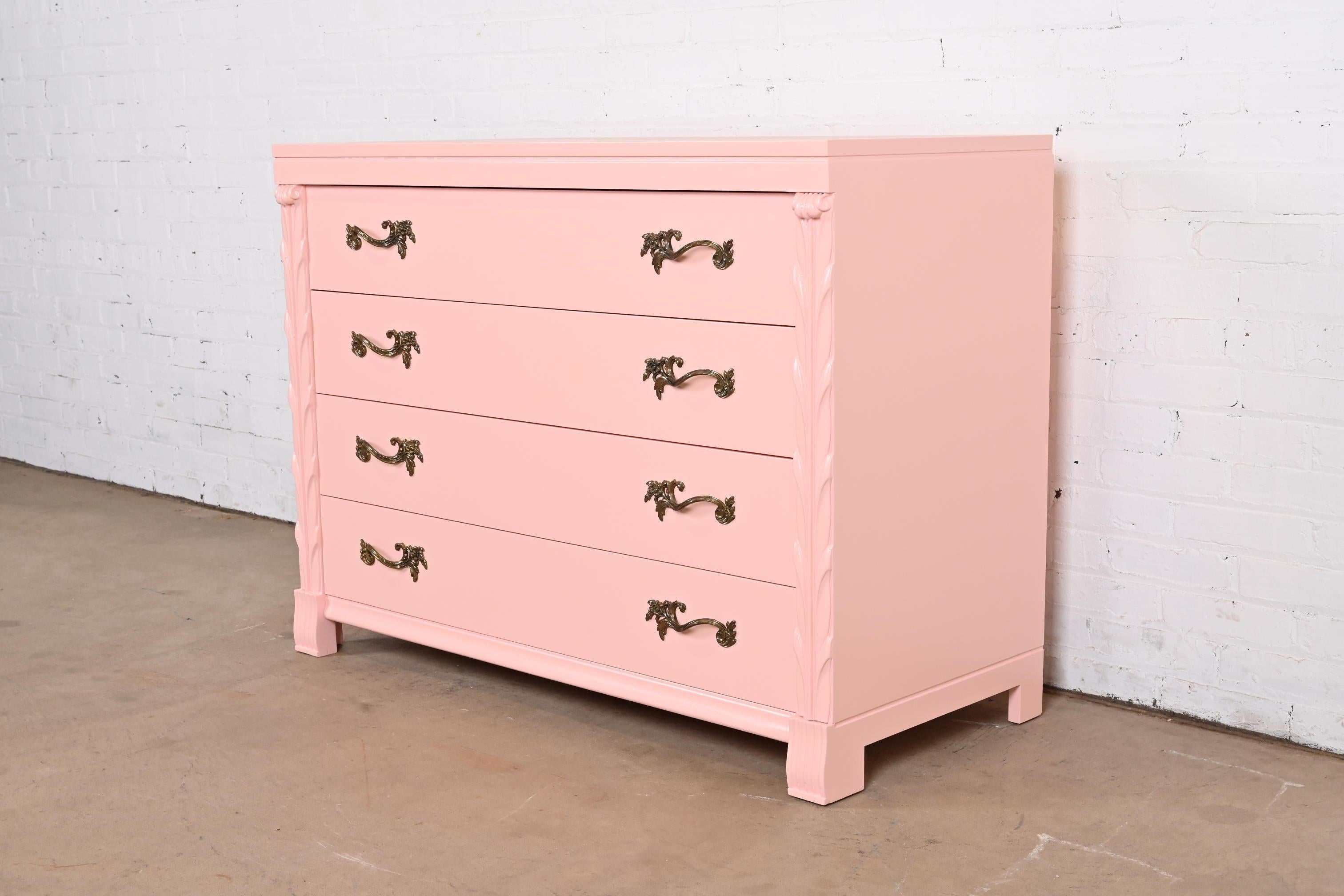 An outstanding French Regency Louis XV style dresser or chest of drawers

By John Stuart

USA, Circa 1940s

Pink lacquered mahogany, with original brass hardware.

Measures: 46