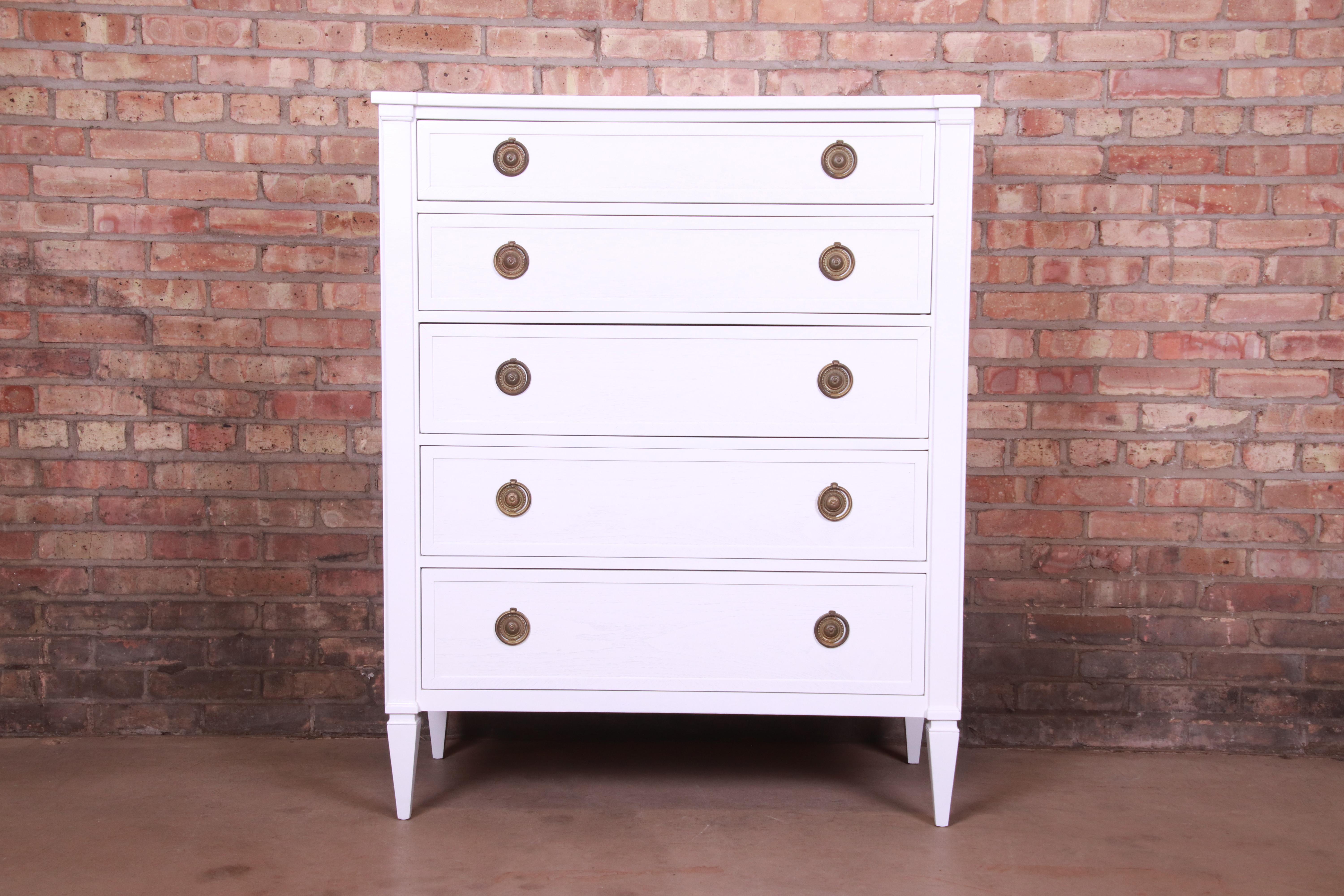 A gorgeous mid-century French Regency or neoclassical style five-drawer highboy dresser

By John Stuart for Mt. Airy 