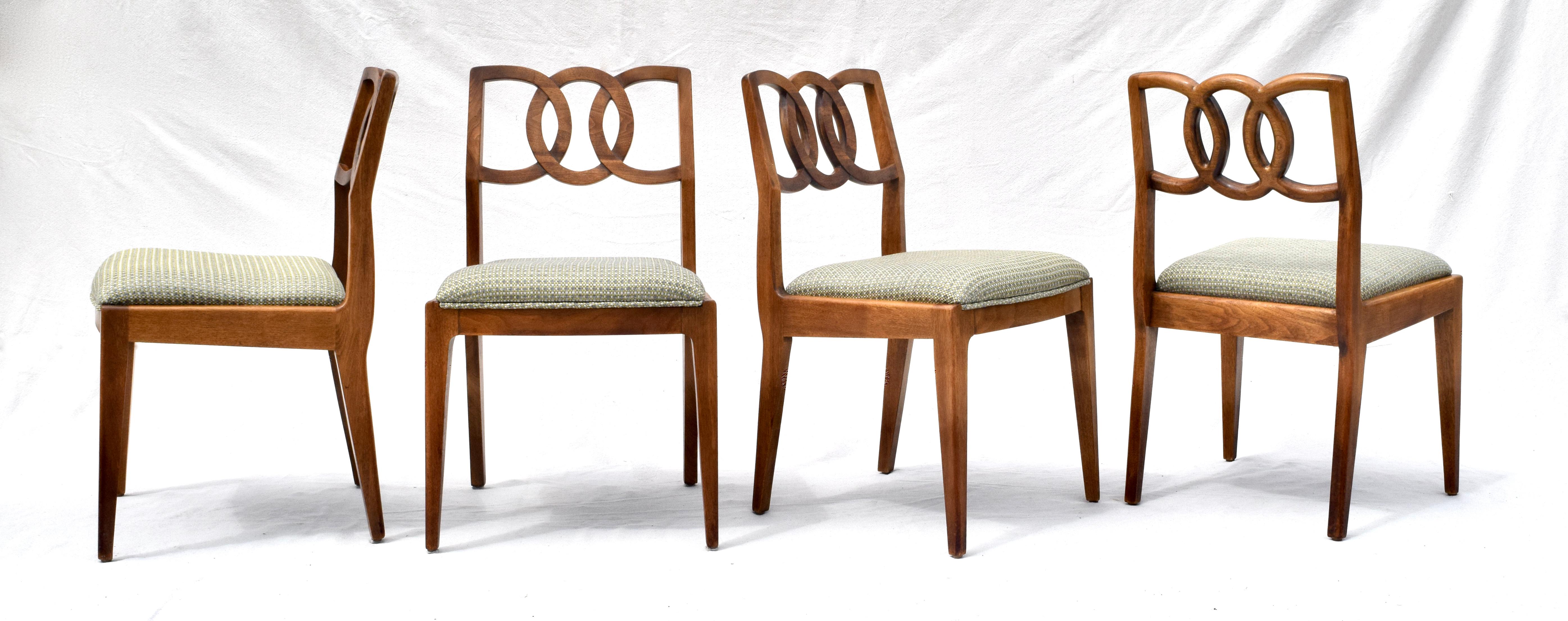 Set of 6 John Stuart walnut interlocking backs dining chairs with new Thom Filicia upholstered seats in excellent vintage condition. Beautifully maintained sculptural forms of solid wood construction with all original hand rubbed