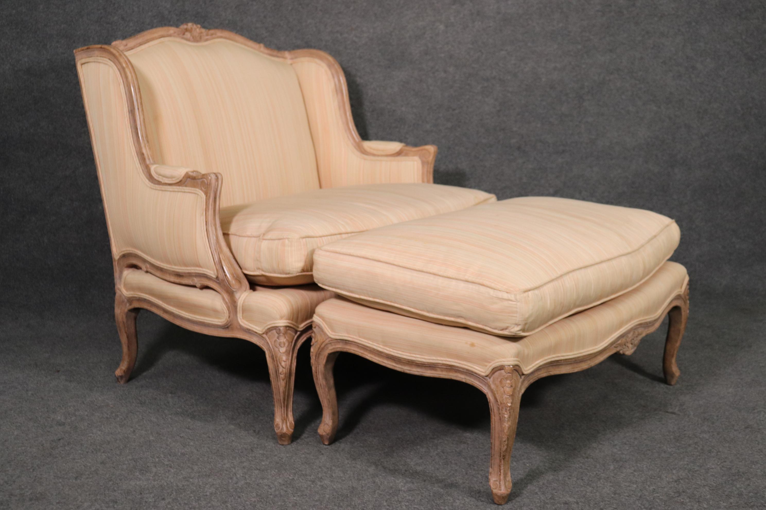 This is a fantastic two piece set of John Stuart American-made bergere with matching ottoman. The frame is gorgeous with a glazed painted finish from the factory. The frame is distressed to look antique. The upholstery is used and will show stains