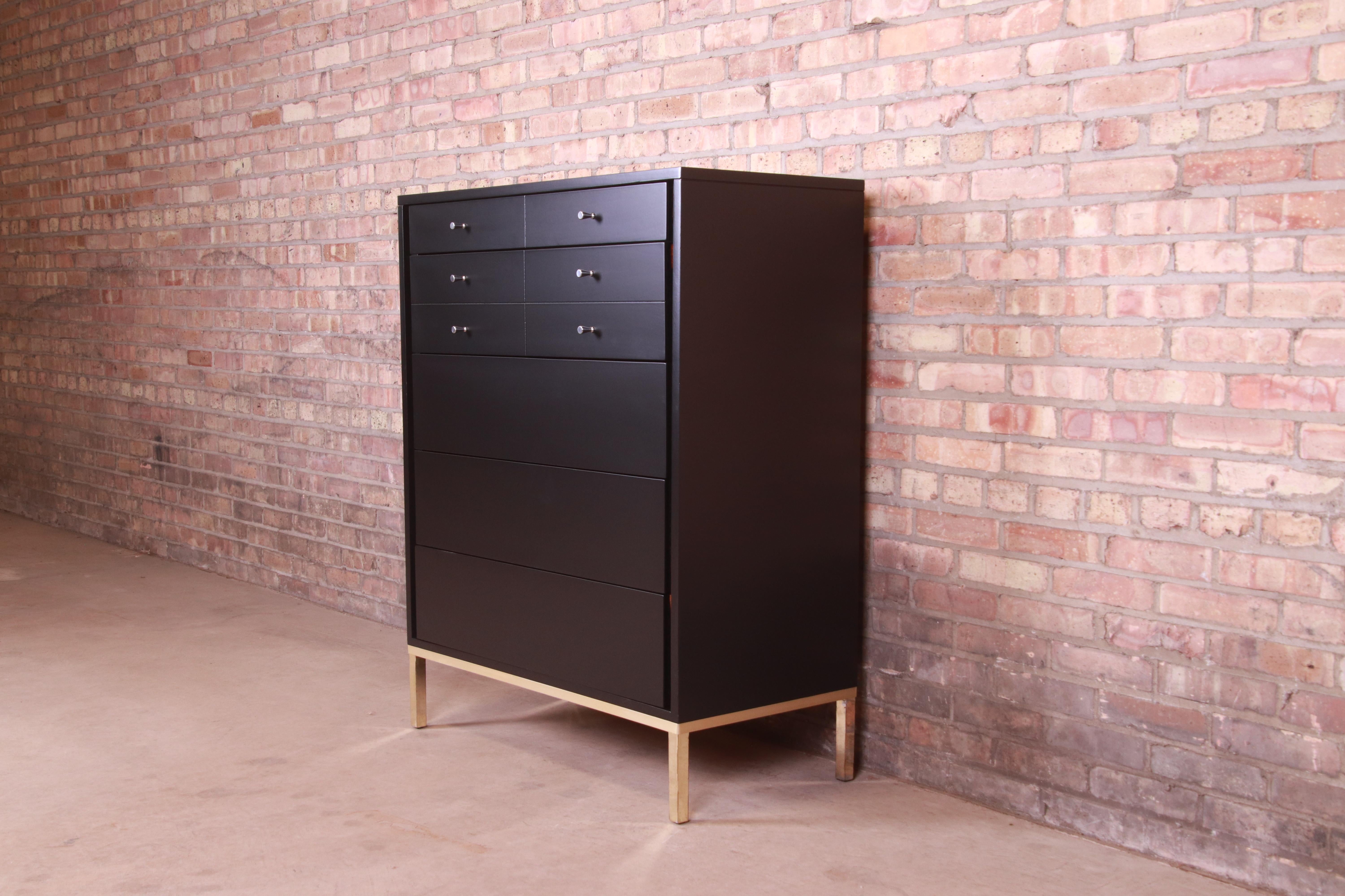 An exceptional Mid-Century Modern highboy dresser

By John Stuart

USA, Circa 1960s

Black lacquered walnut, with brass base, and original nickel hardware.

Measures: 36