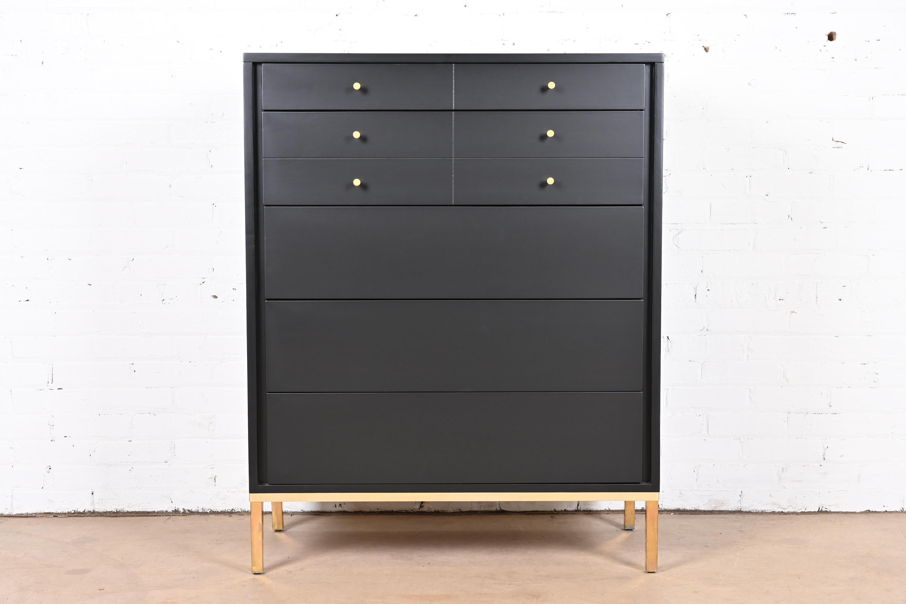 An exceptional Mid-Century Modern highboy dresser

By John Stuart

USA, Circa 1960s

Black lacquered walnut, with brass base and hardware.

Measures: 36