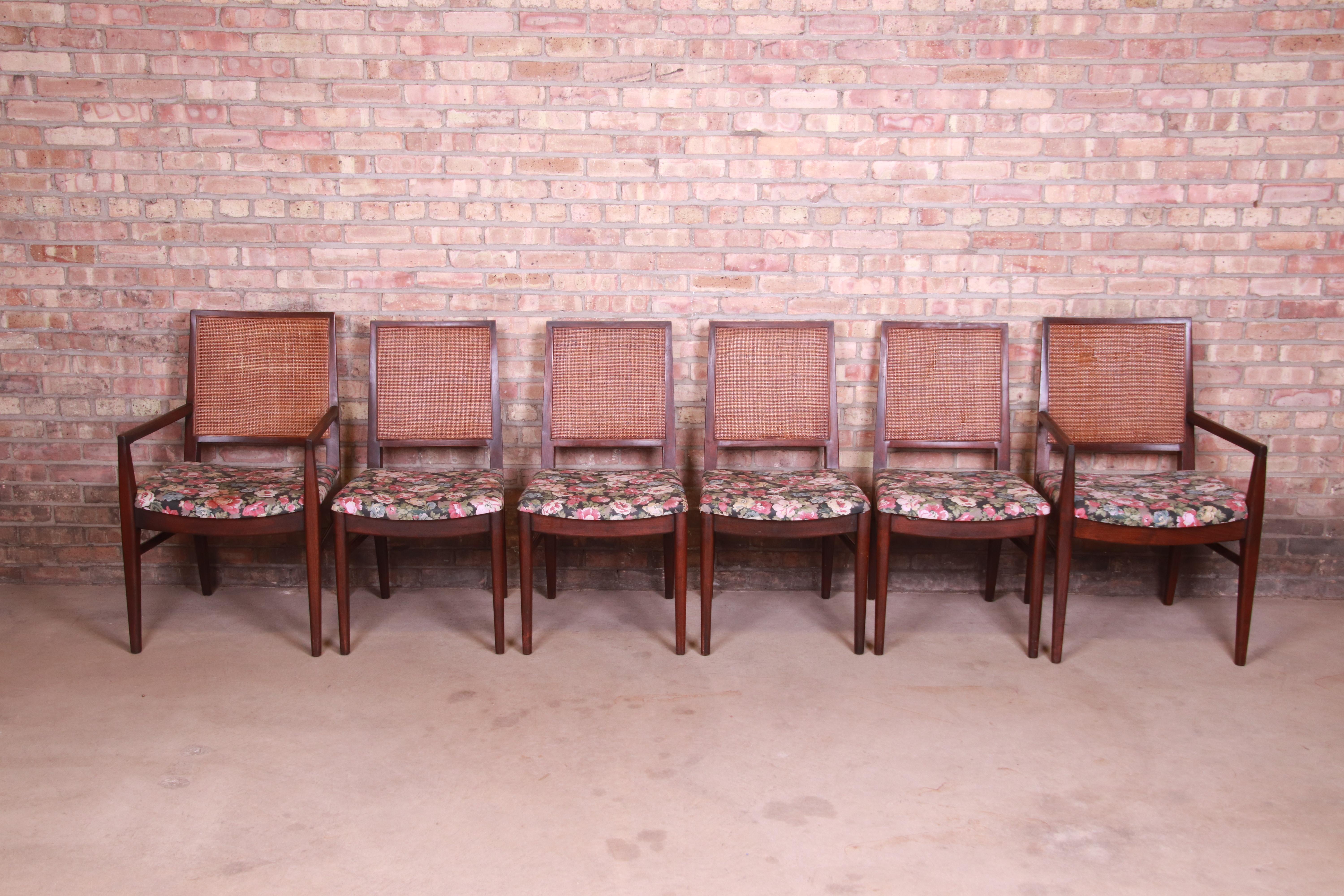 A gorgeous set of six Mid-Century Modern dining chairs

By John Stuart

USA, 1960s

Solid walnut frames, with cane backs and upholstered seats.

Measures:
Armchairs - 22