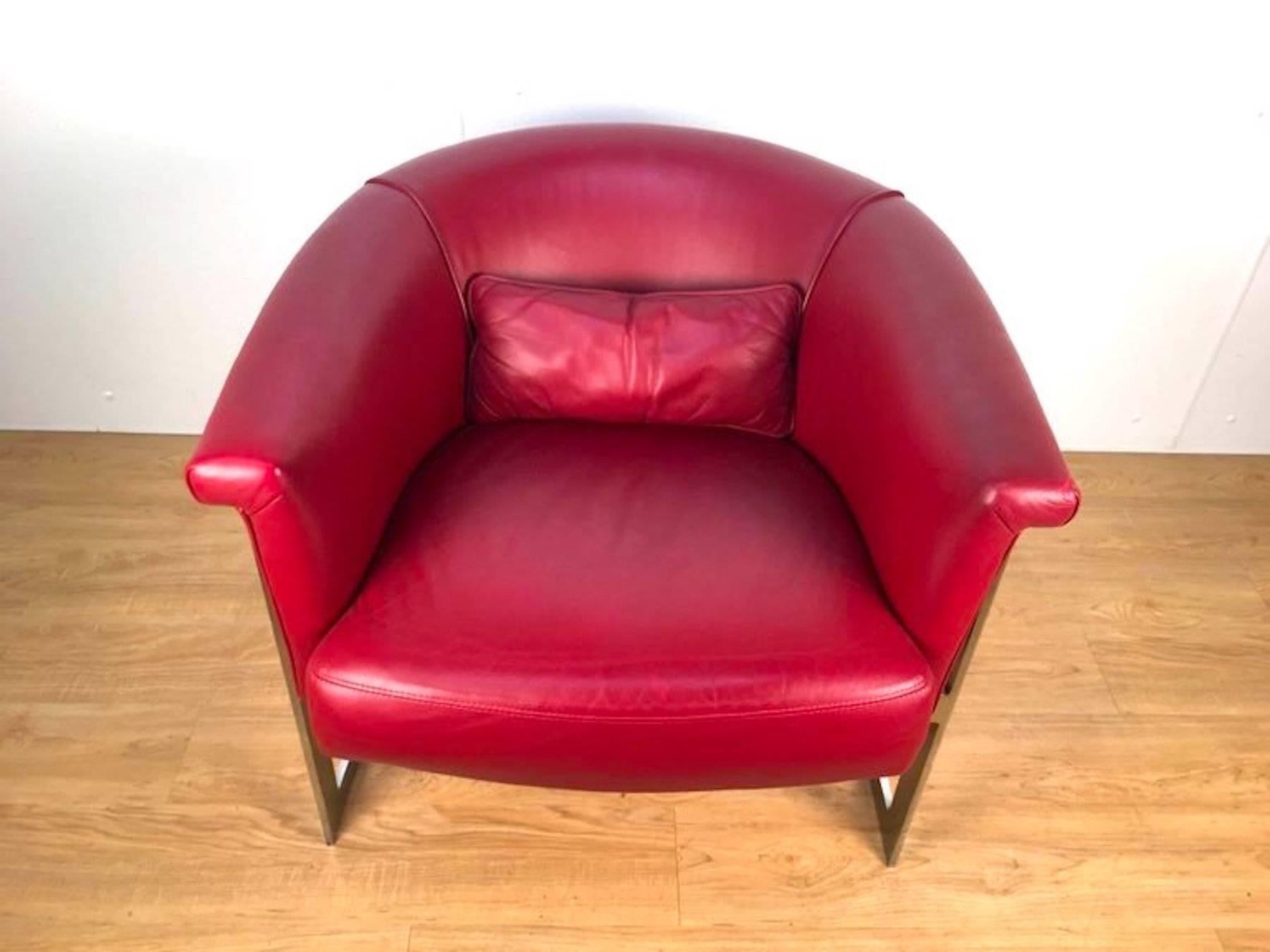 John Stuart style rounded lounge chair in custom red leather. Clean, bright frame with rich red leather upholstery and accent pillow.