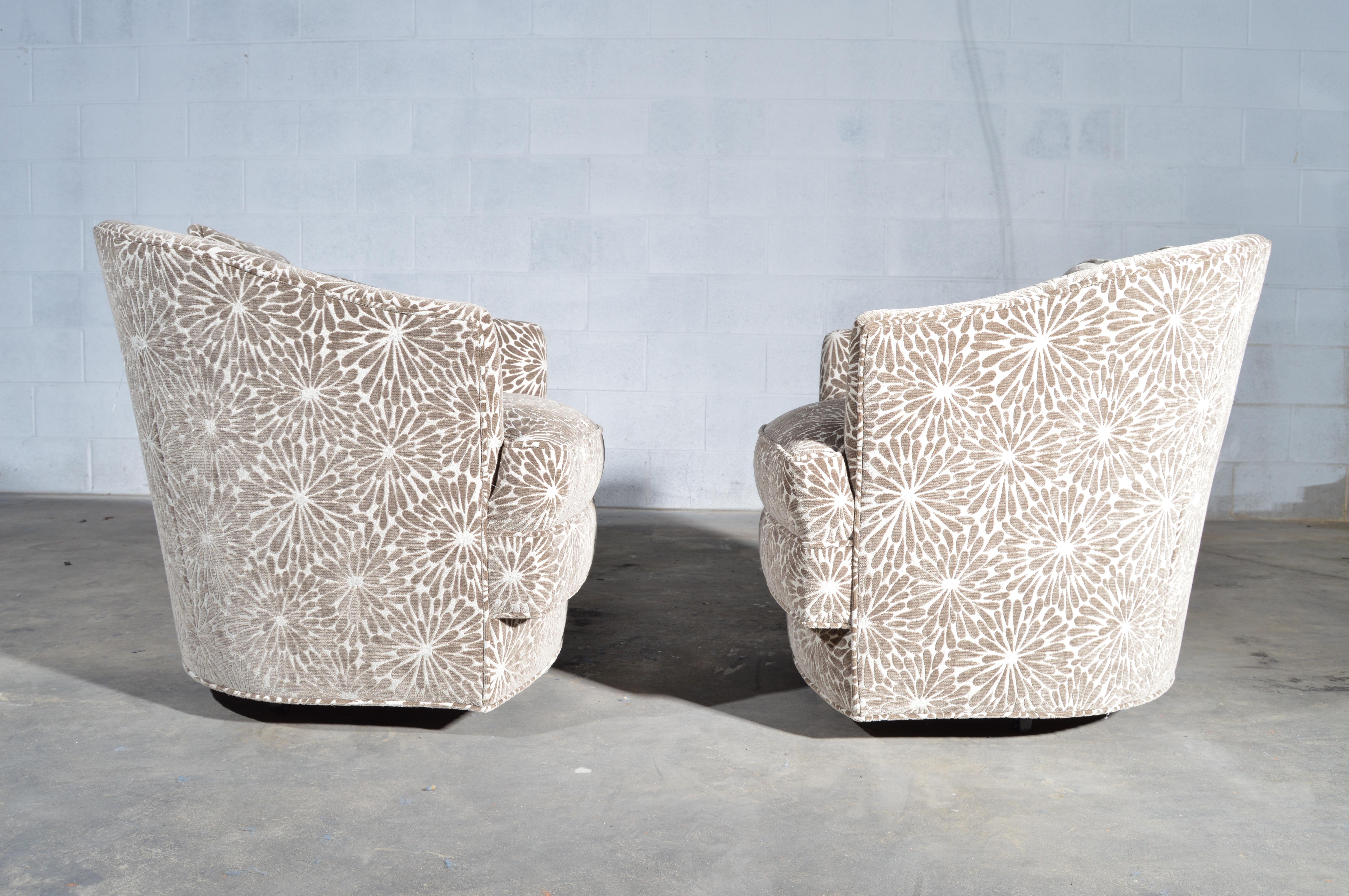 A pair of John Stuart swivel armchairs on casters, model 2150 having textured mohair upholstery.
Produced in 1970 with original labels underneath of both chairs. Each chair comes with its matching throw pillow.