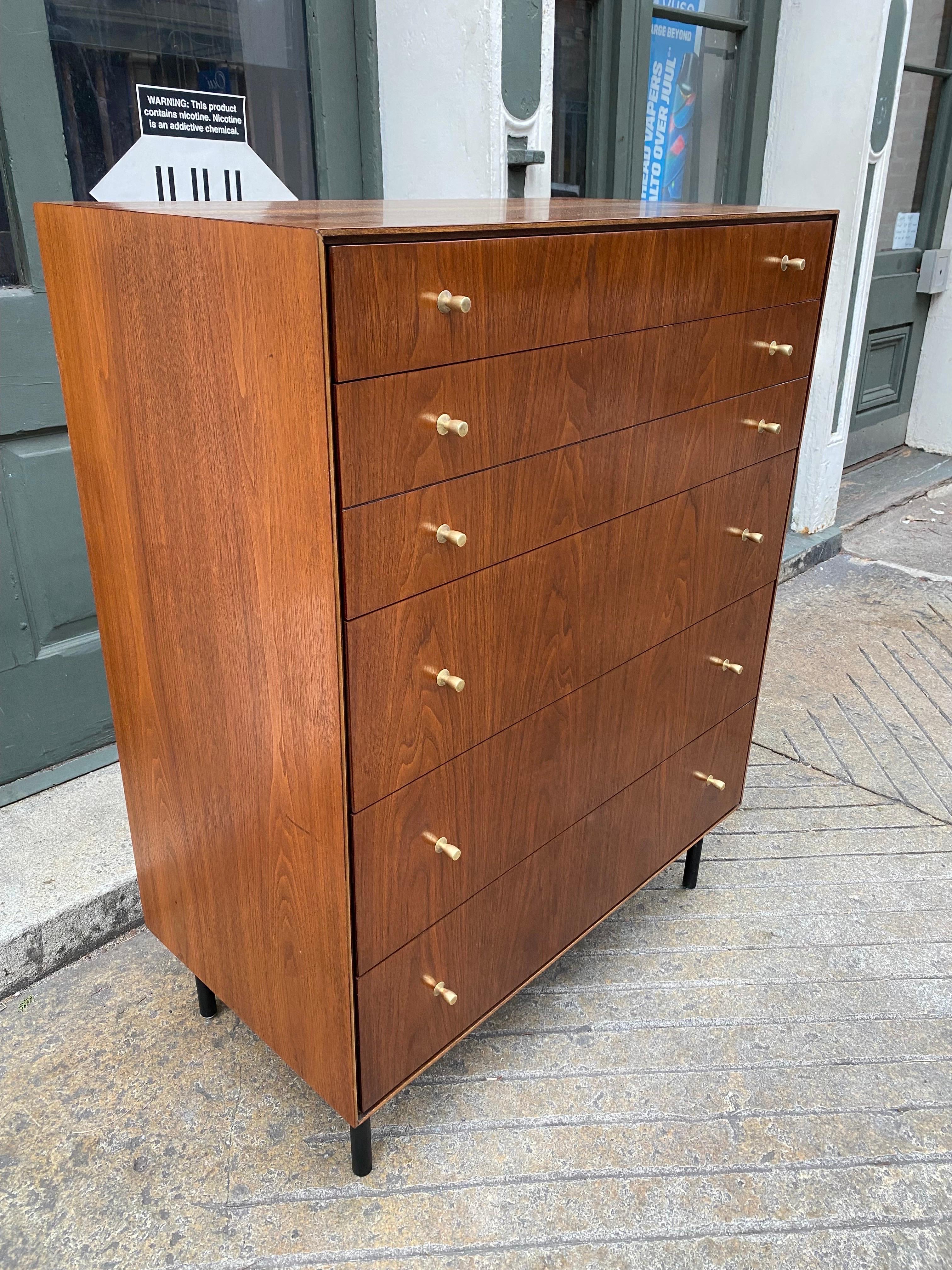 John Stuart Walnut Dresser with brass Knobs and new black iron legs.  Book matched walnut veneer gives this dresser an amazing look!  One shallow top drawer and then 4 deep drawers below, 2nd drawer has the appearance of two more shallow drawers. 