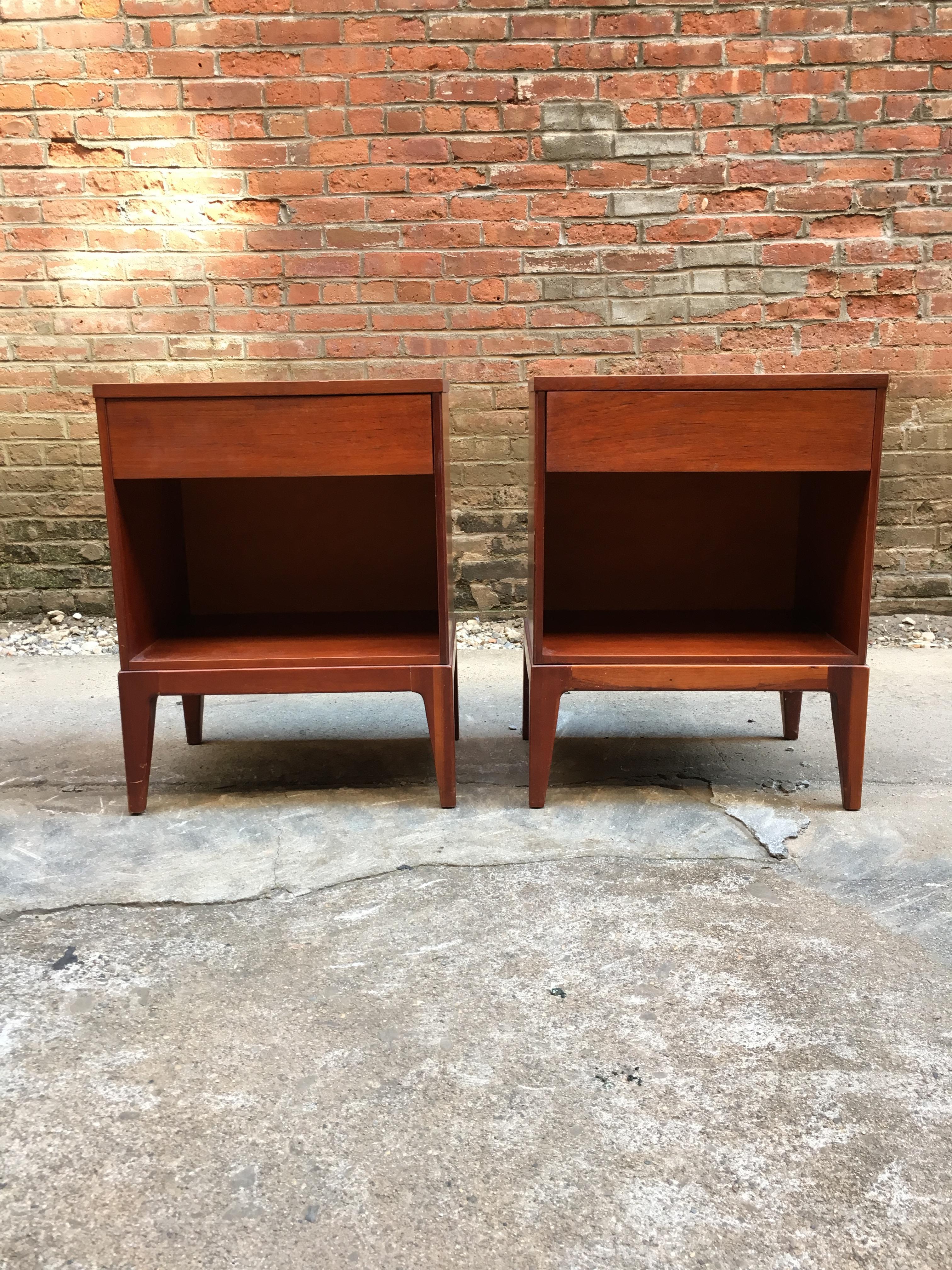 Pair of John Stuart teak nightstands or end tables. Single drawer on four tapered legs, circa 1960-1965. 

