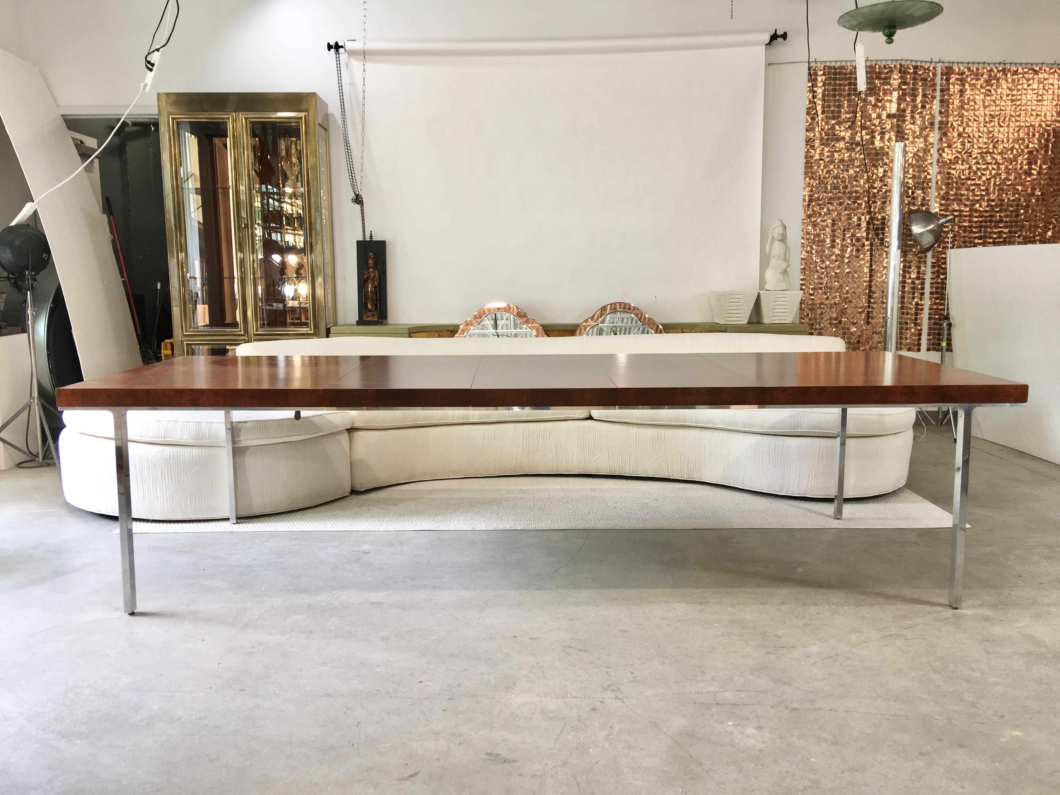 Minimalist clean lines on this 1960s dining table by John Stuart with mirror-polished cast aluminum legs. 
Measures: 29