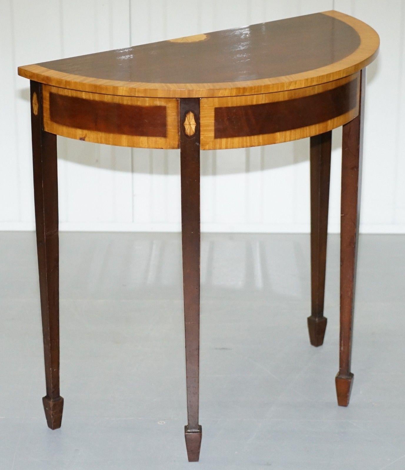 We are delighted to offer for auction this lovely satinwood and mahognay Sheraton revival demi lune console table made by John Tanous LTD London

A truly stunning piece in exquisite condition throughout, the detail is to die for, the half fan
