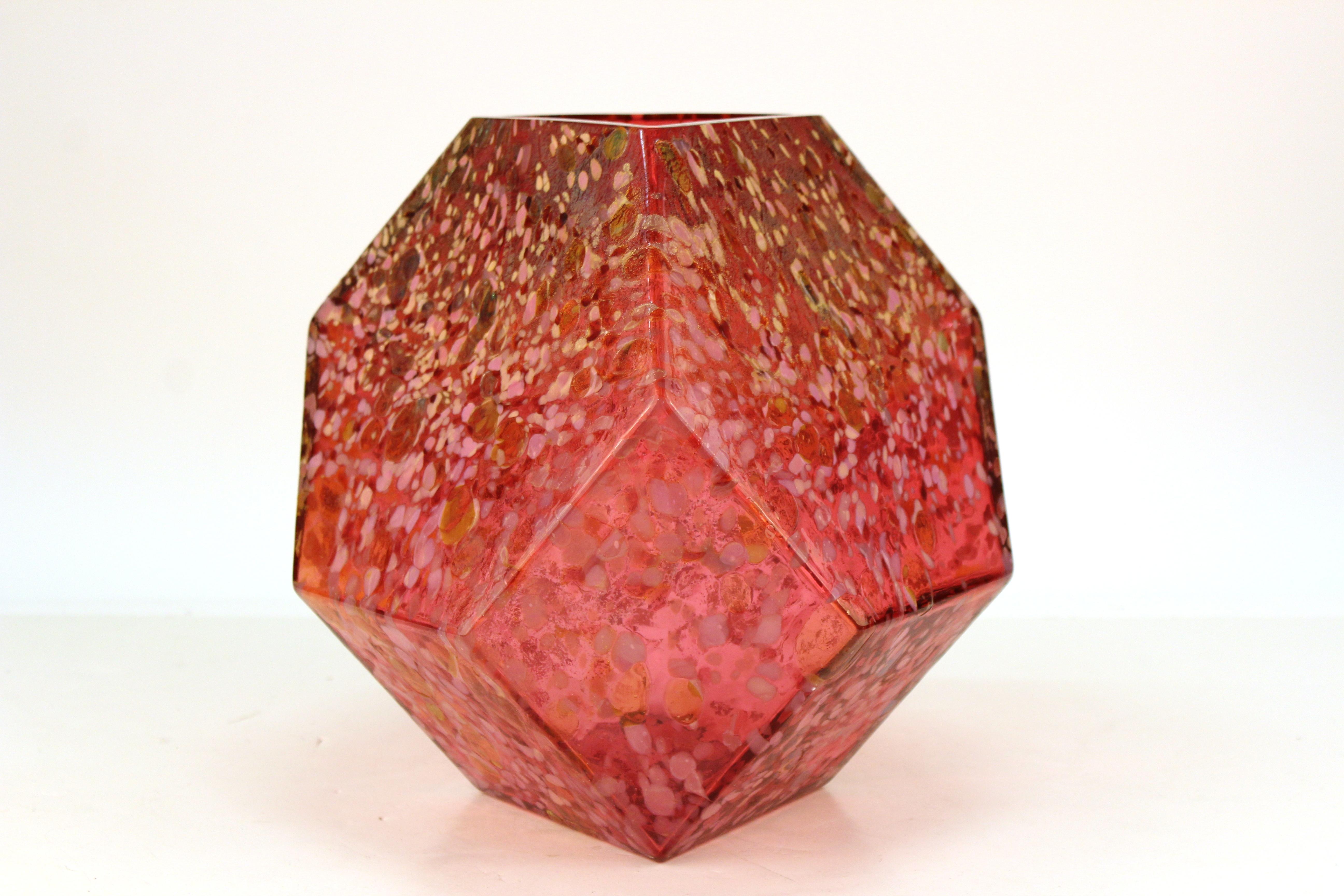 Geometric style modern faceted art glass sculpture or vase, created by New-York based artist John Torreano (b. 1941) in the late 20th century. The piece has remarkable translucent effects due to the use of various incorporated color elements within