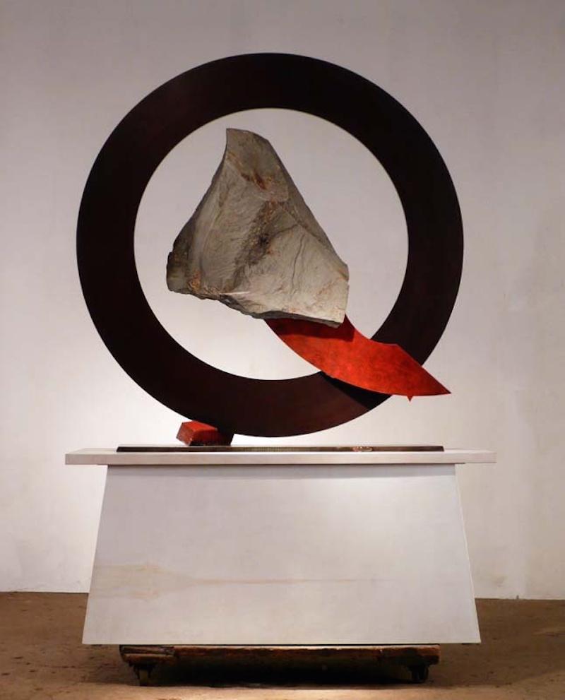 Sisyphean Circle (Diagonally Down), John Van Alstine.

Stone and metal, usually granite or slate and found object steel are central in my sculpture. The interaction of these materials is a major focus. On the most basic level the work is about the