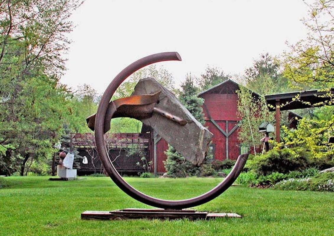 Sisyphean Circle XXV, John Van Alstine.

Stone and metal, usually granite or slate and found object steel are central in my sculpture. The interaction of these materials is a major focus. On the most basic level the work is about the marriage of the