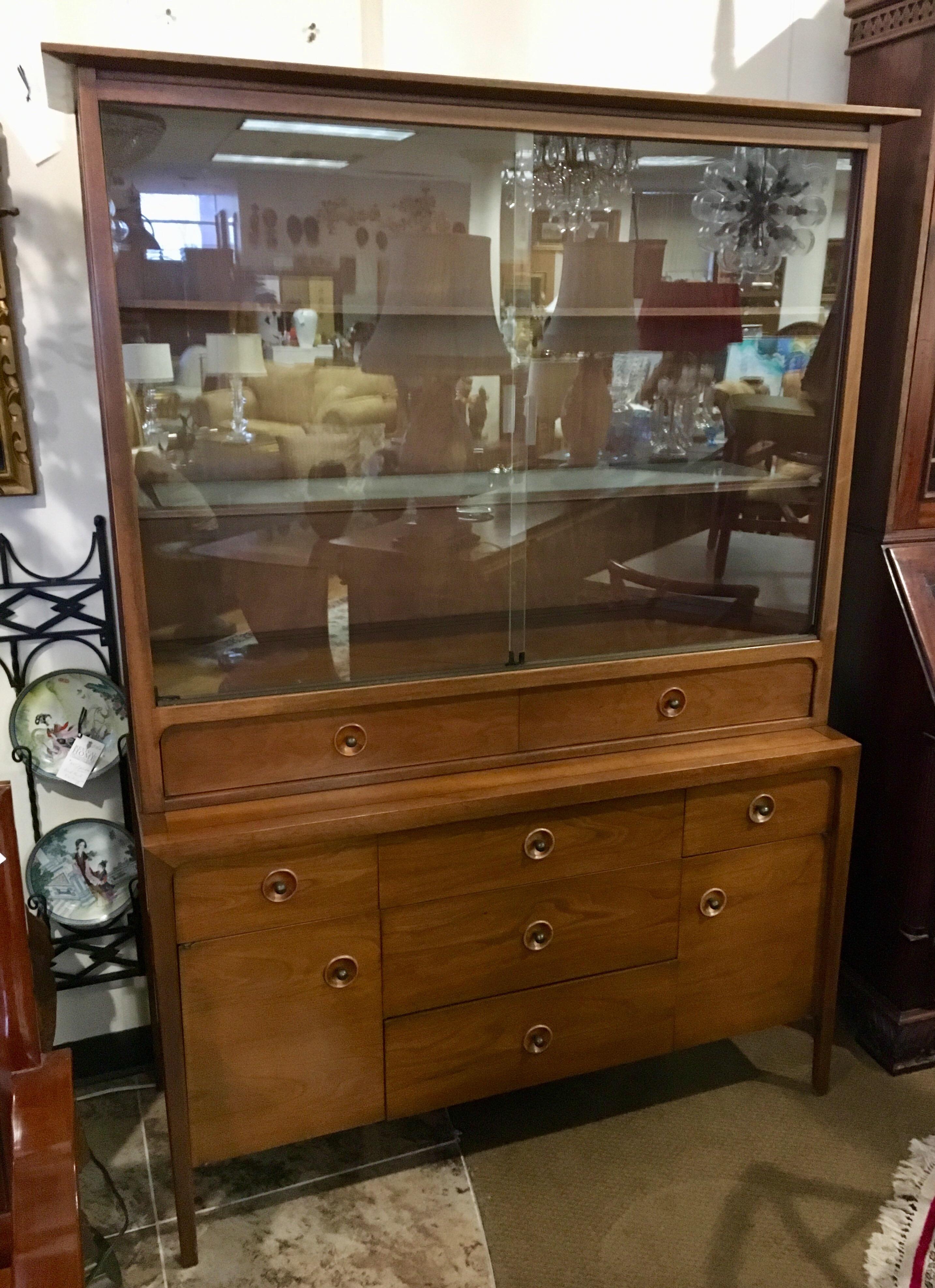 Mid-Century Modern signed John Van Koert Classic for Drexel.
Classically elegant, this Mid-Century Modern Drexel counterpoint piece can be used as a breakfront, credenza or sideboard and has ample storage, illumination at top and glass doors and