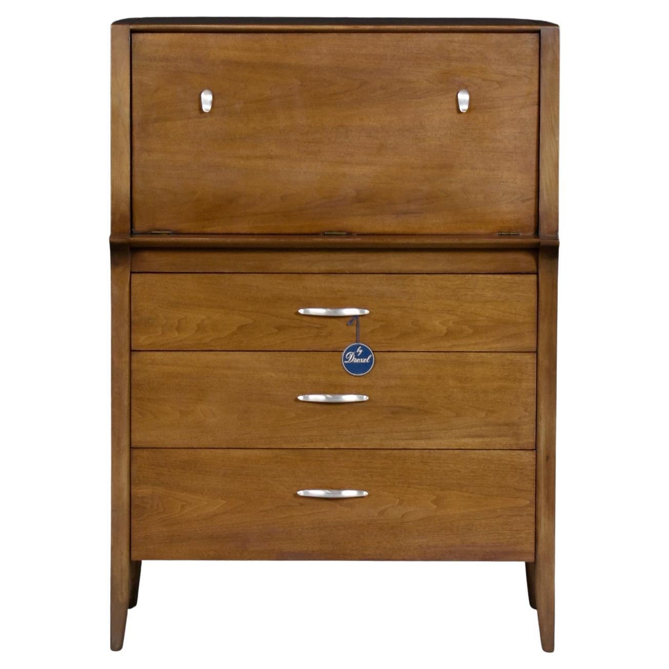 K12 Man’s Chest designed by John Van Koert for Drexel’s “Profile” collection. Collectors revel – this dresser comes with it’s original tag! Van Koert began his career as a jewelry designer which is evidenced in the beautifully contoured pulls. The