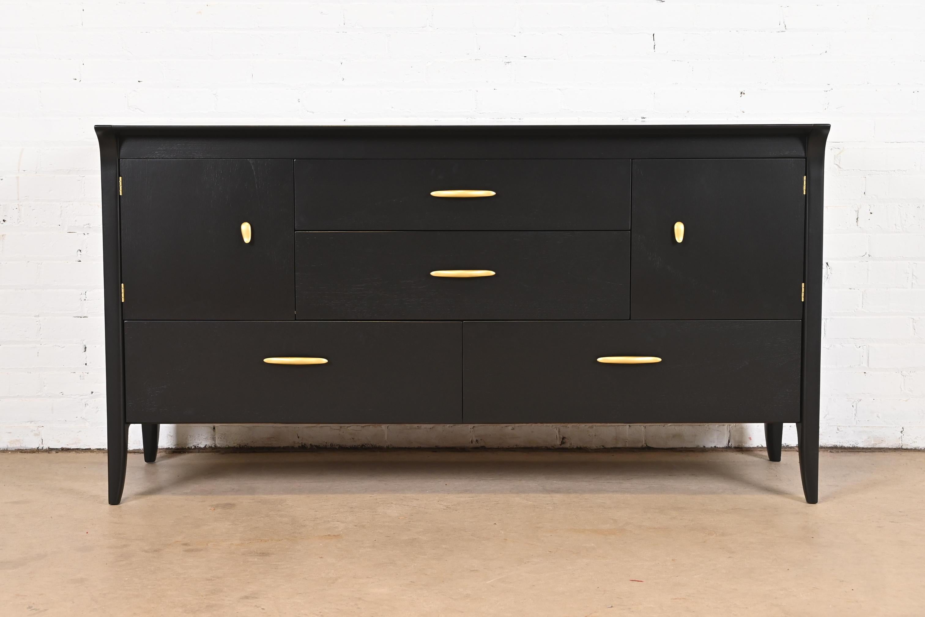 A sleek and stylish Mid-Century Modern dresser, credenza, or sideboard

By John Van Koert for Drexel, 
