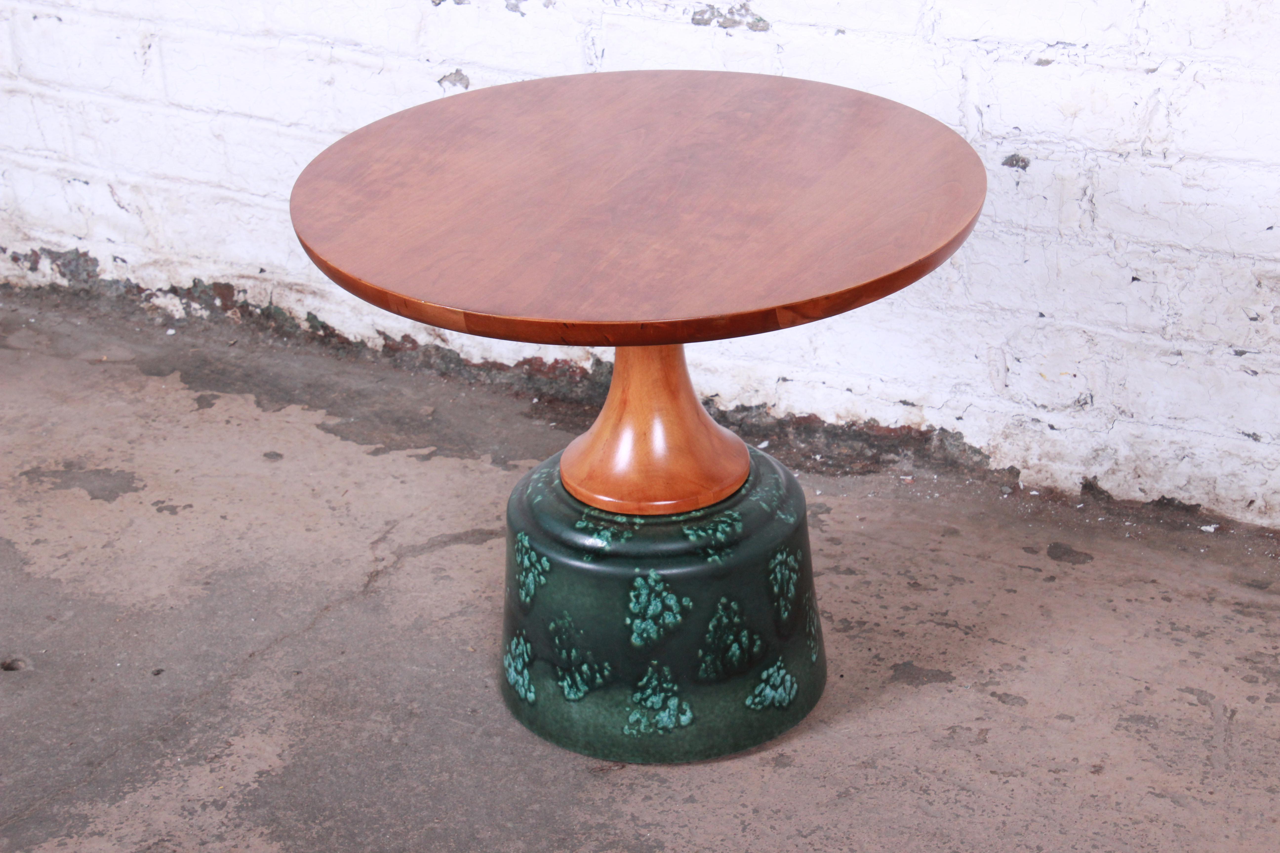 A rare and exceptional Mid-Century Modern occasional table designed by John Van Koert for Drexel Furniture. Van Koert combined Mid-Century Modern ceramics with fine woodwork to produce these exceptional tables in 1956. The table features a unique