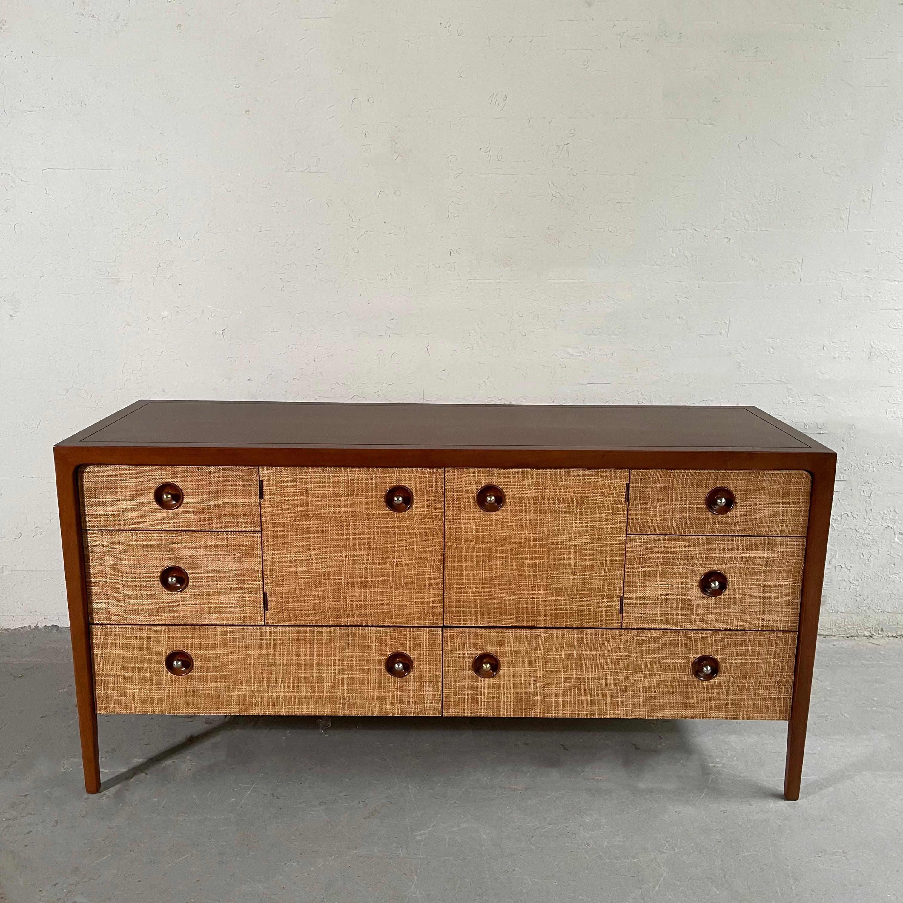 Mid-Century Modern, mahogany, credenza dresser by John Van Koert for Drexel Counterpoint features a custom grasscloth facade treatment that contrasts nicely with his signature round brass plated recessed pulls. This cabinet has six drawers and a