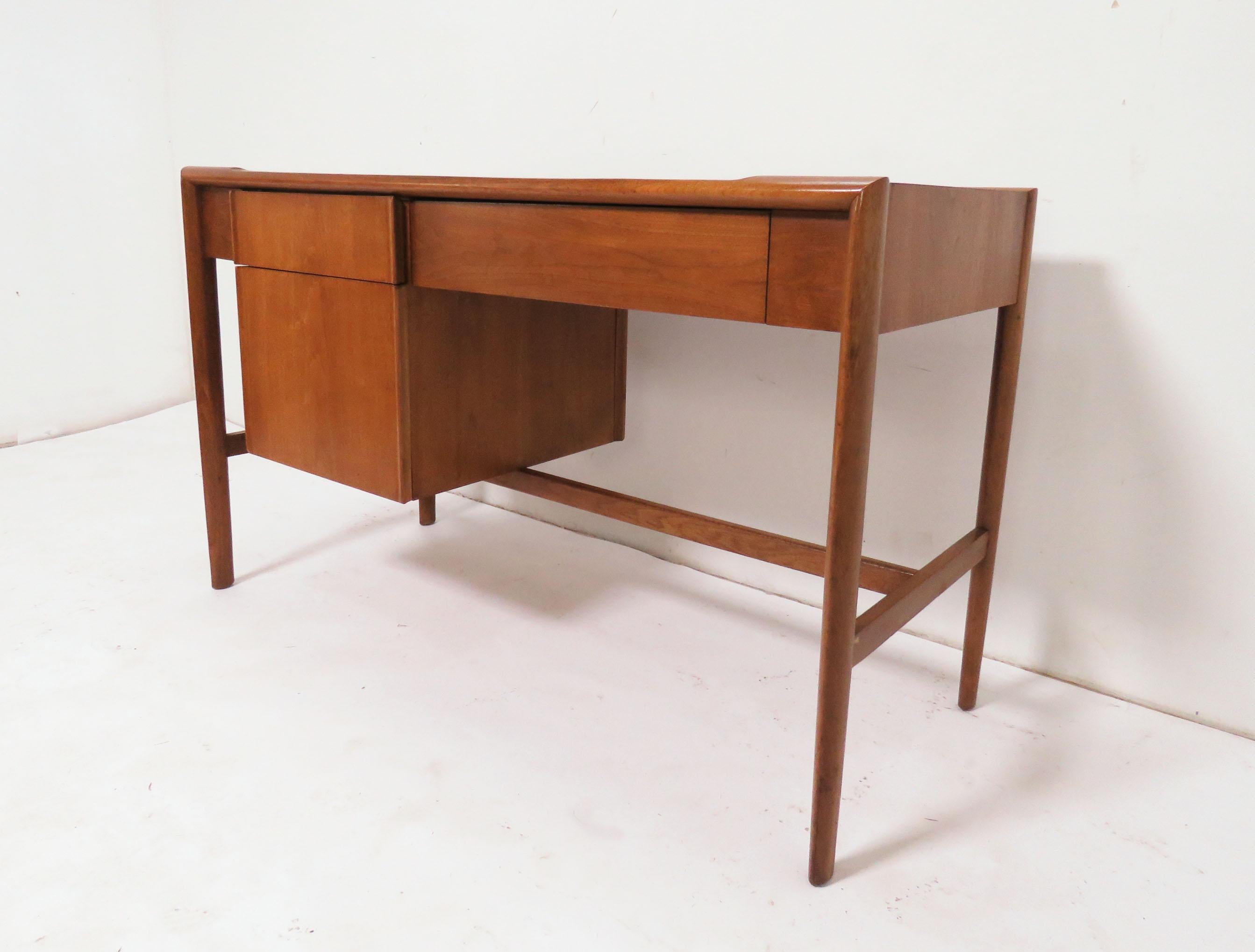 Midcentury desk by John Van Koert for Drexel, circa 1960s. With its narrow profile of 20.5