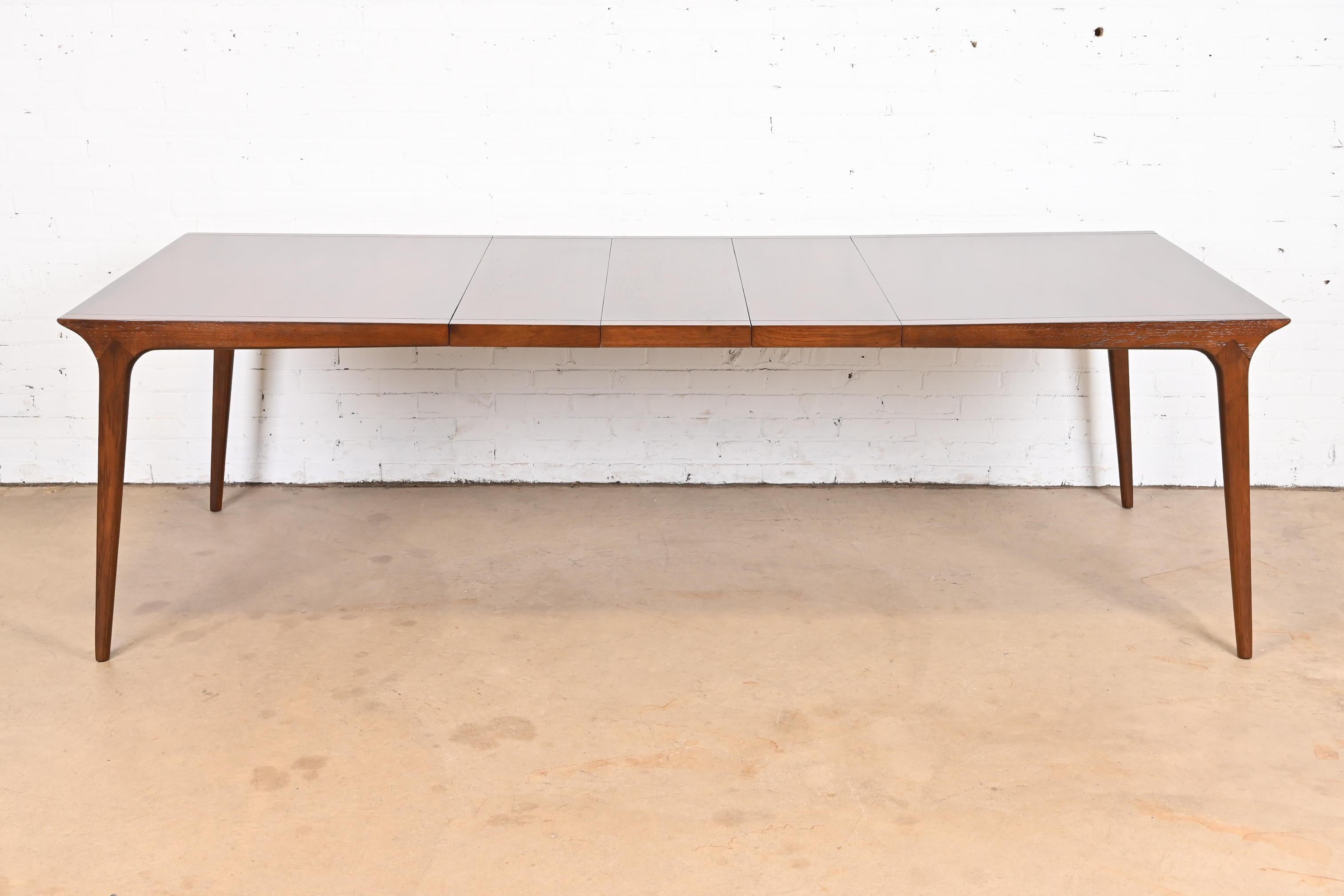 An exceptional Mid-Century Modern walnut extension dining table

By John Van Koert for Drexel, 