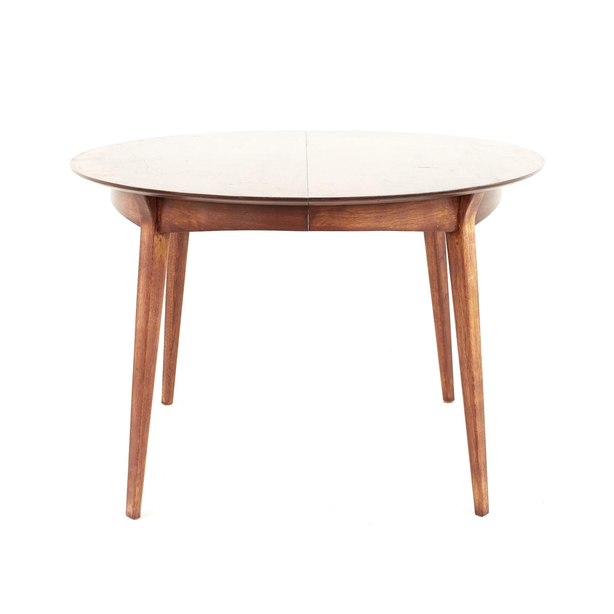 John Van Koert for Drexel mid century round expanding dining table

This table measures: 44 wide x 44 deep x 30 inches high, with a chair clearance of 26.25, each of the 3 leaves measures 12 inches wide, making a maximum table width of 80