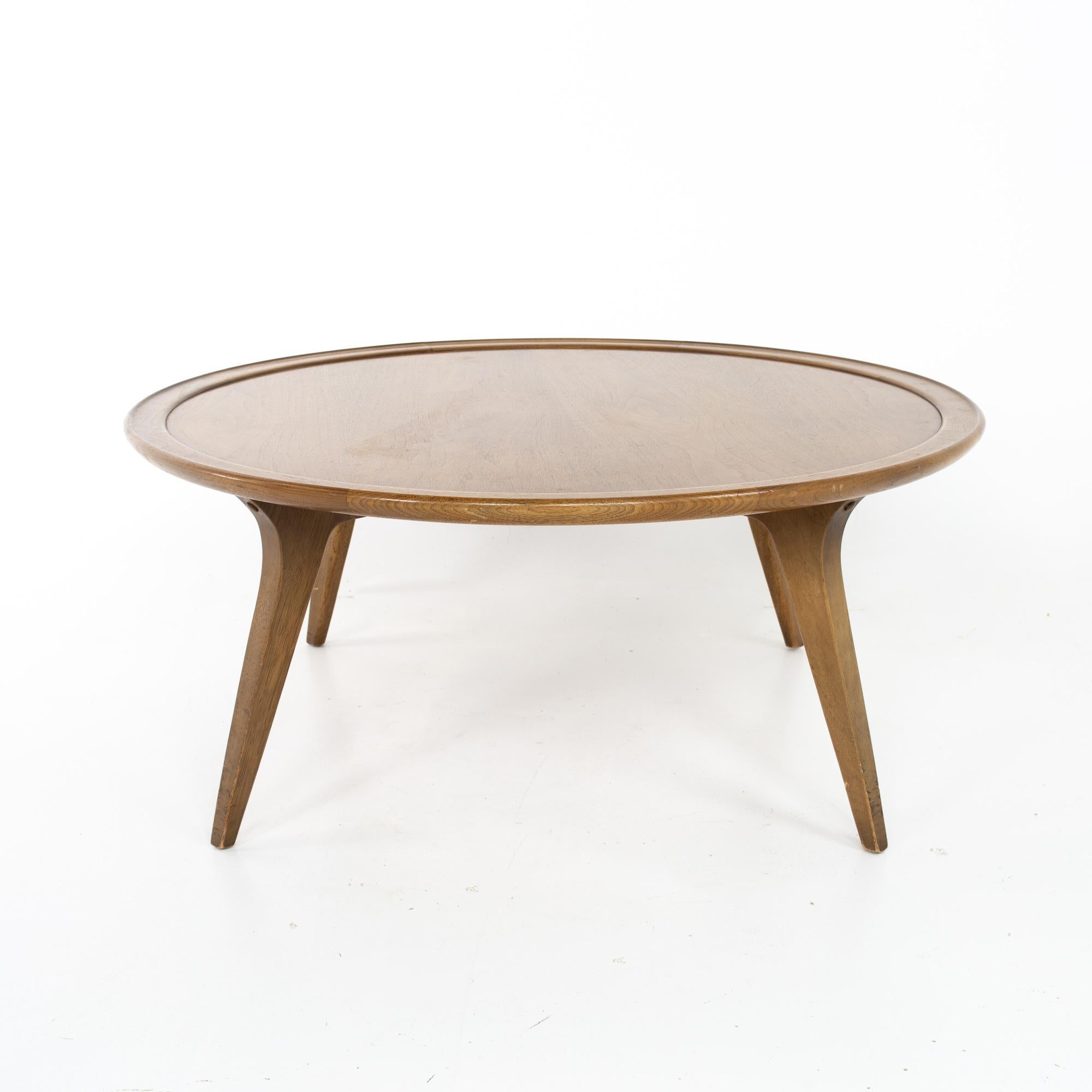 John Van Koert for Drexel Mid Century round coffee table.
Table measures: 38 wide x 38 deep x 16.5 inches high

Each piece of furniture is available in what we call restored vintage condition. Upon purchase it is thoroughly cleaned and minor repairs