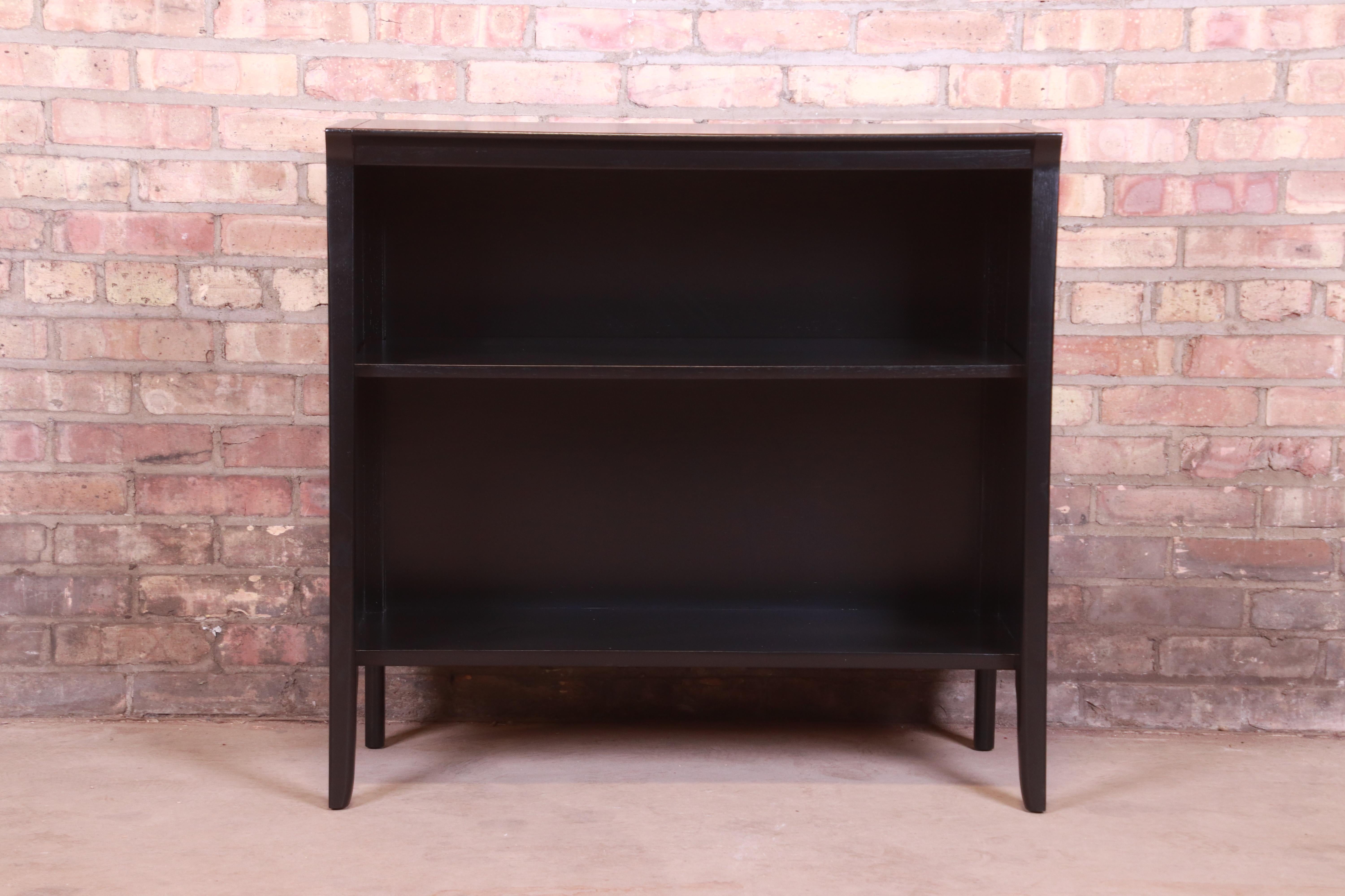 An exceptional Mid-Century Modern black lacquered walnut bookcase

By John Van Koert for Drexel 