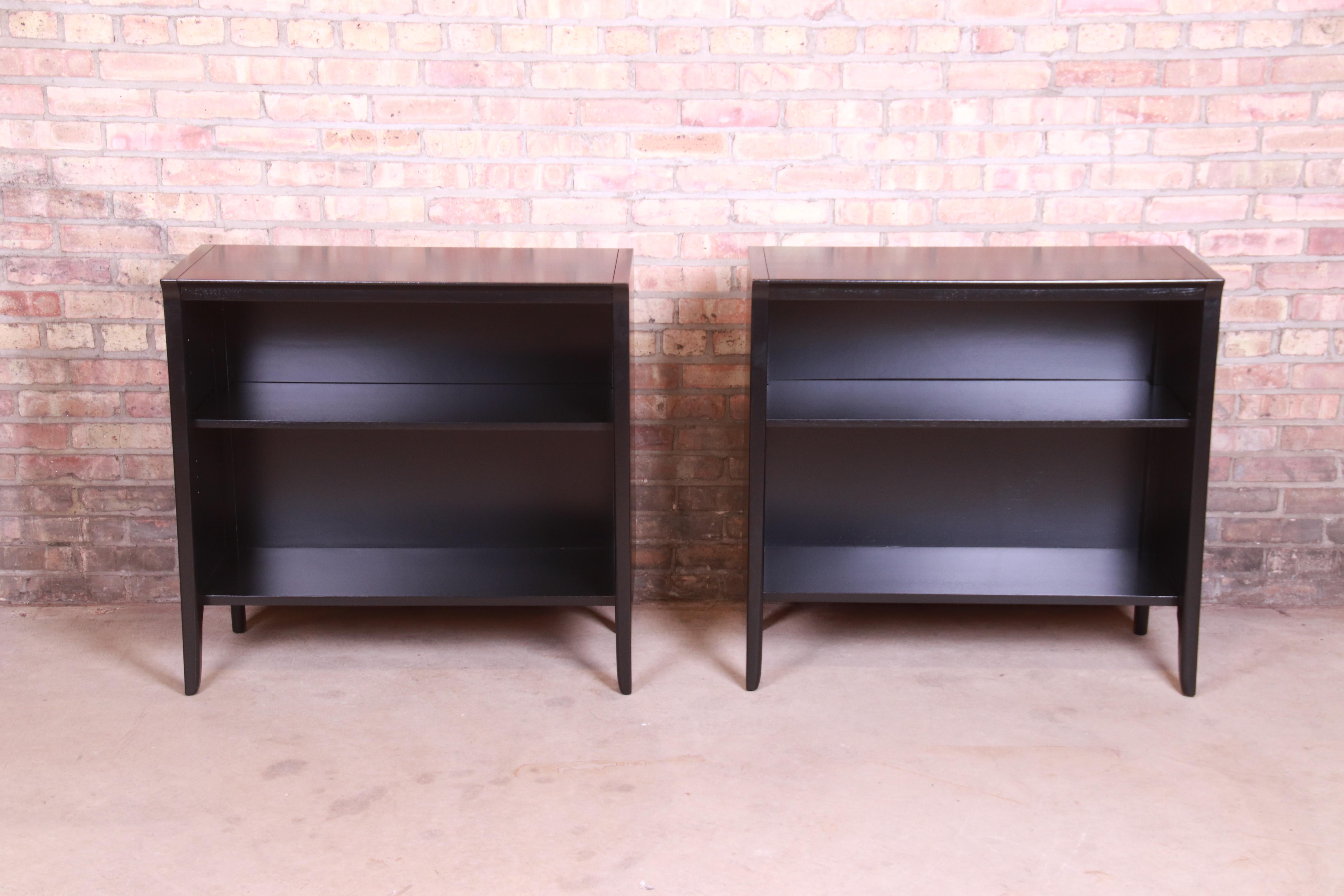 An exceptional pair of Mid-Century Modern black lacquered walnut bookcases

By John Van Koert for Drexel 