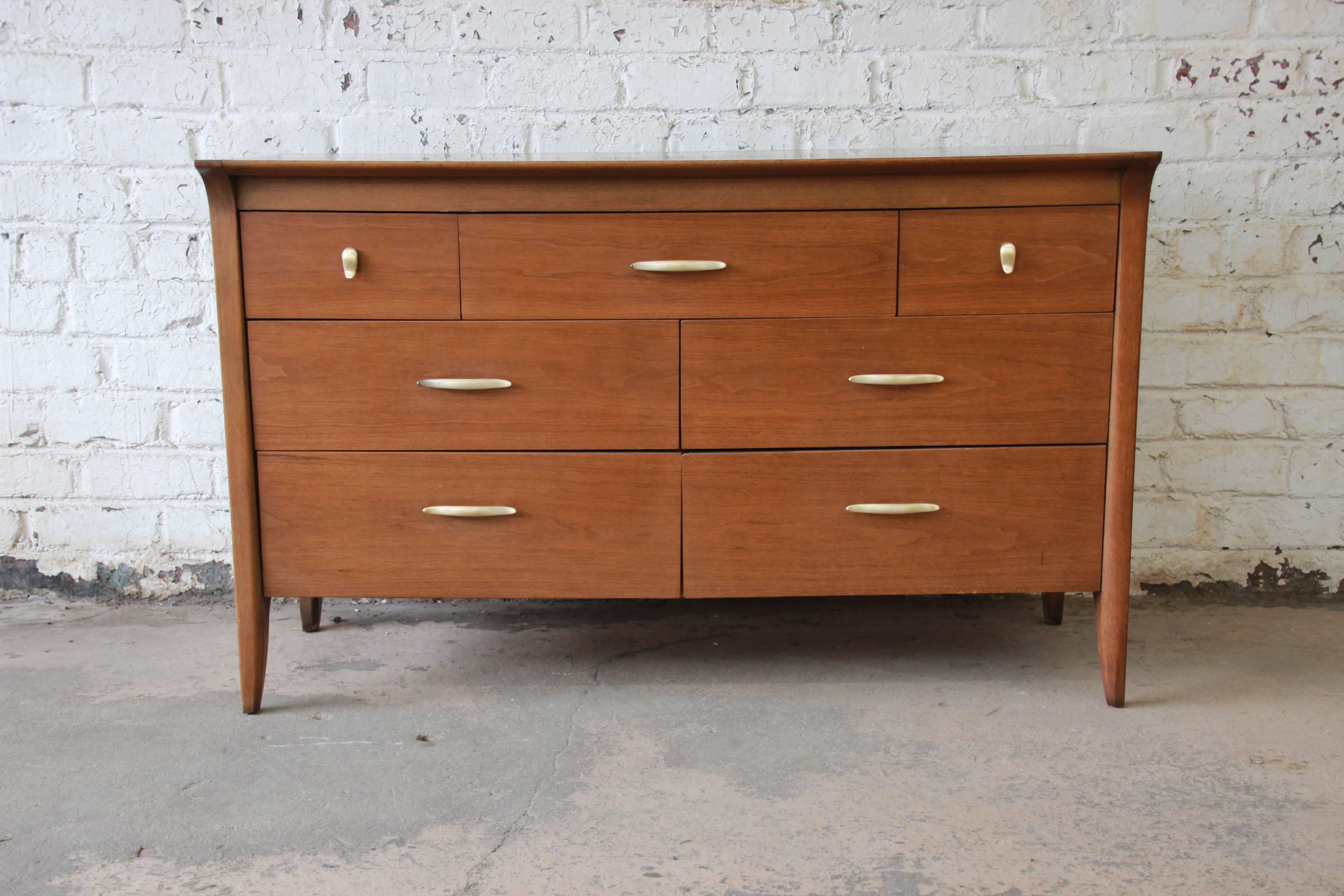 A stylish Mid-Century Modern seven-drawer dresser or credenza by John Van Koert for the 