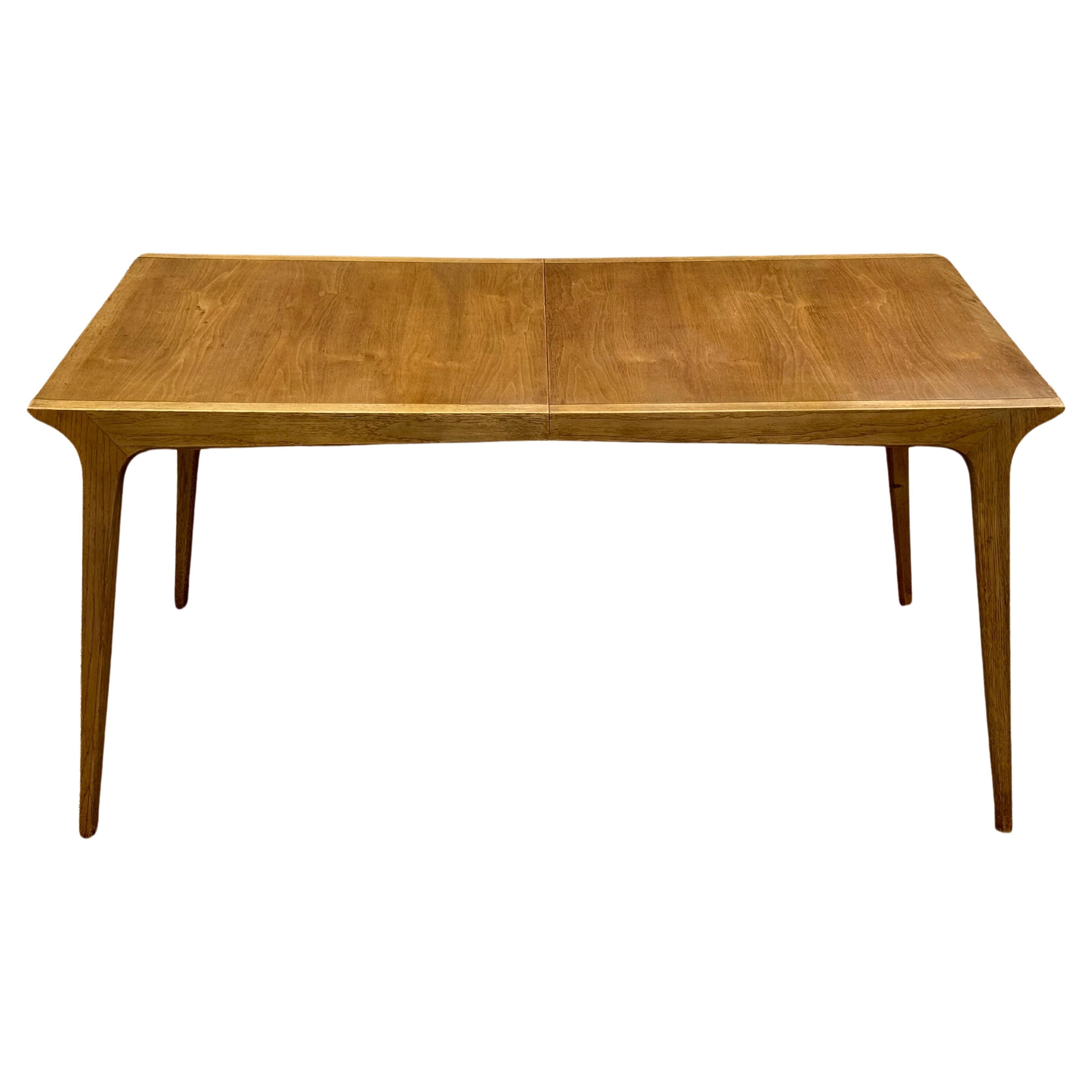 John Van Koert for Drexel designed sculptural & sophisticated architectural form model K-42-4 dining table, designed as part of the classic Profile series. This large walnut extension table comes complete with three 12