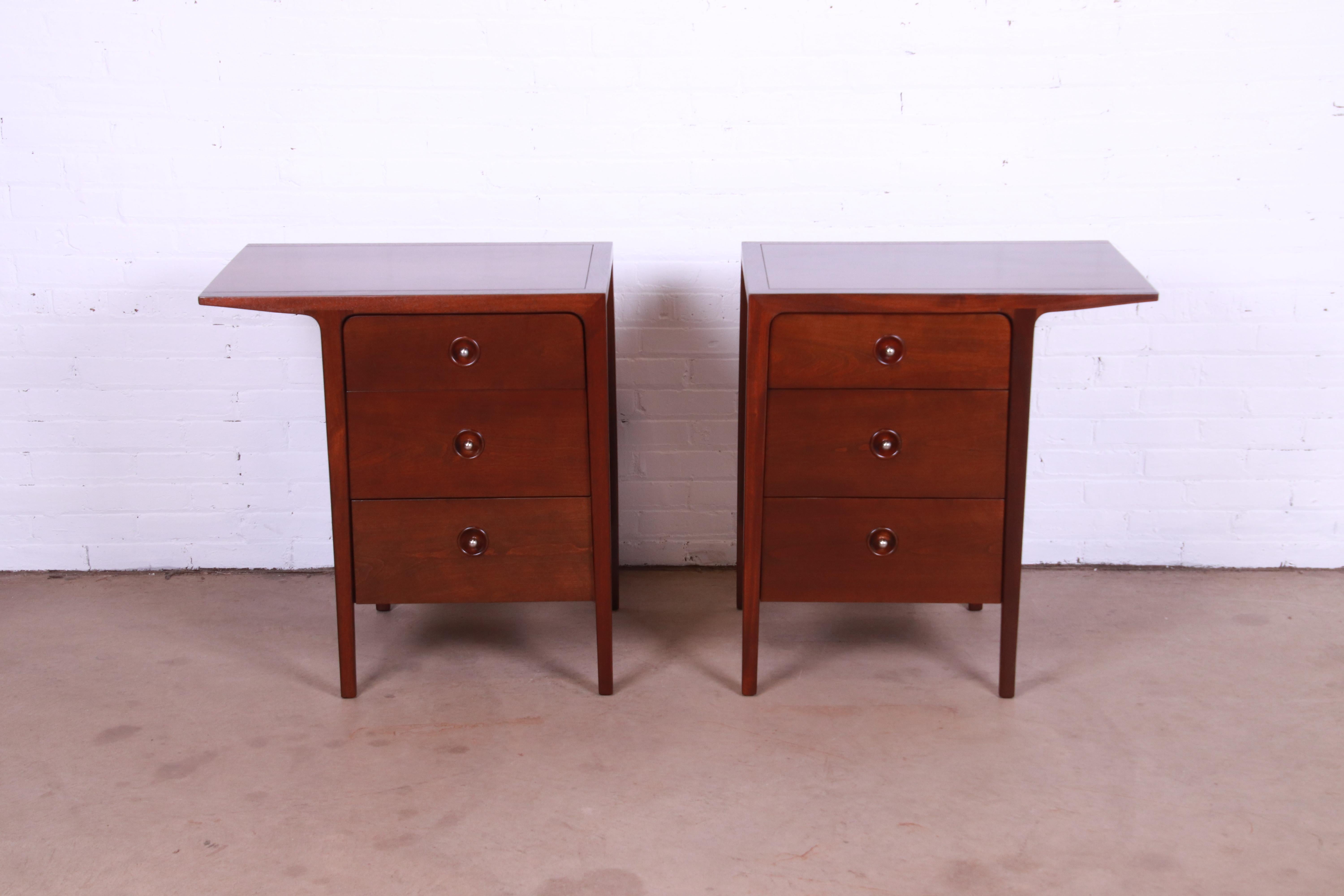 A pair of sleek and stylish mid-century modern sculpted walnut bachelor chests or nightstands with unique cantilevered top

By John Van Koert for Drexel, 