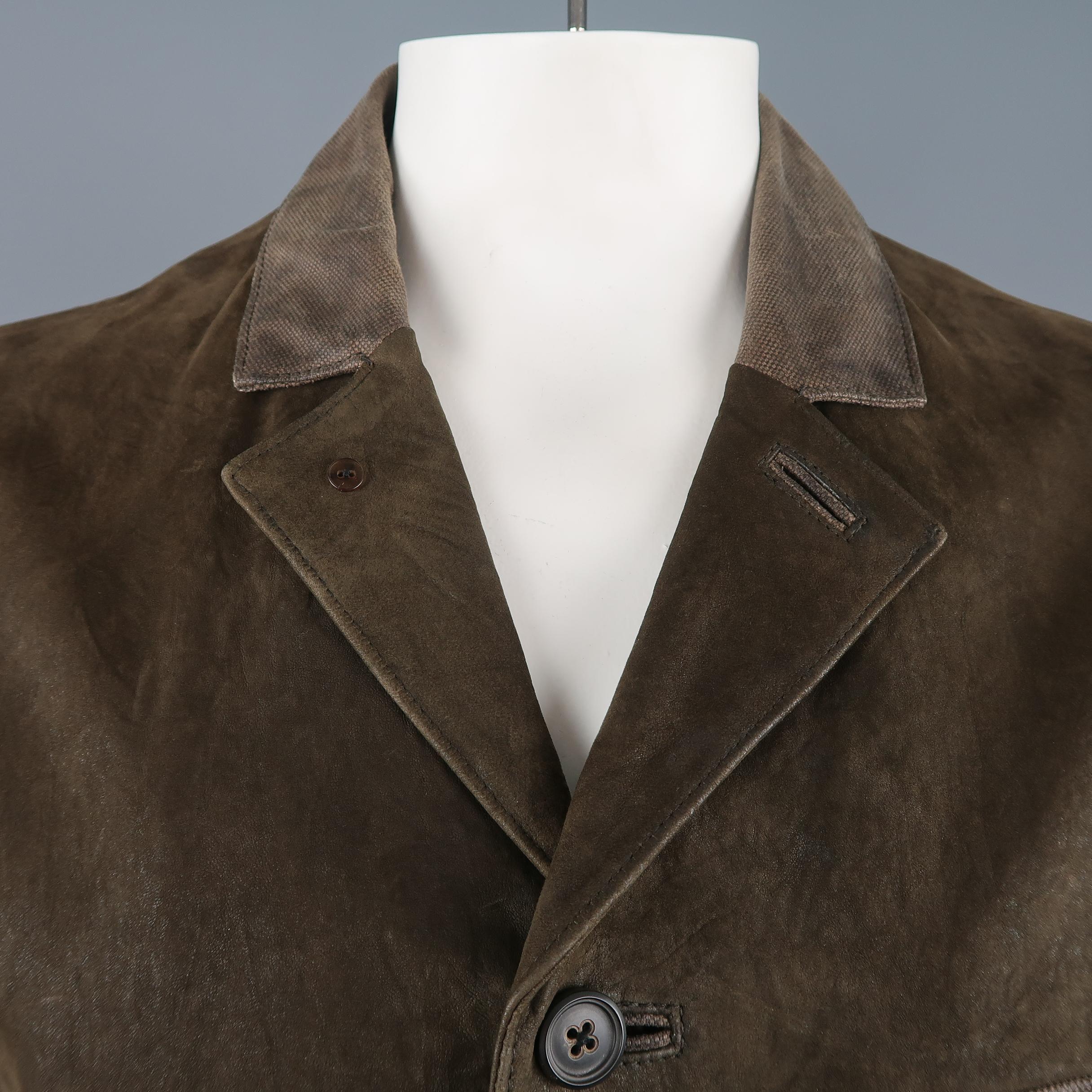 JOHN VARVATOS military style jacket comes in olive green distressed  leather with a half canvas notch lapel, single breasted button up front, and patch flap pockets with canvas trim.
 
Very Good Pre-Owned Condition.
Marked: IT 54
 
Measurements:
