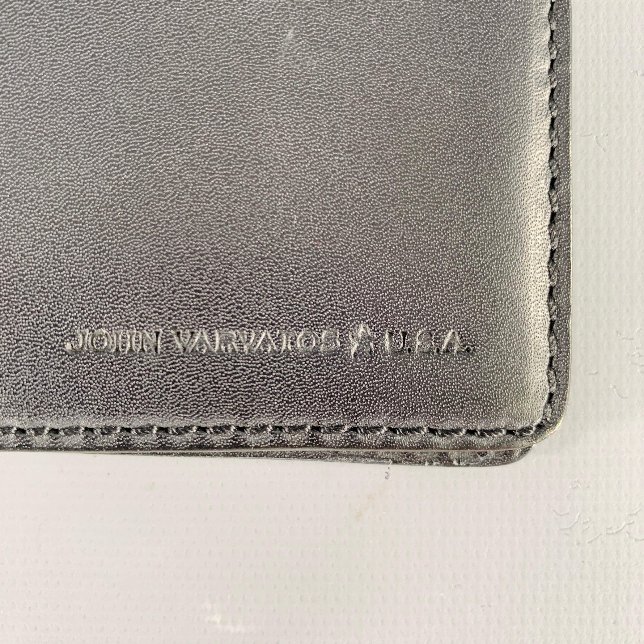 JOHN VARVATOS wallet
in a black leather featuring a bifold style with embossed logo.Excellent Pre-Owned Condition. 

Measurements: 
  Length: 4.25 inches Height: 3.5 inches 
  
  
 
Sui Generis Reference: 133073
Category: Wallet
More Details
   