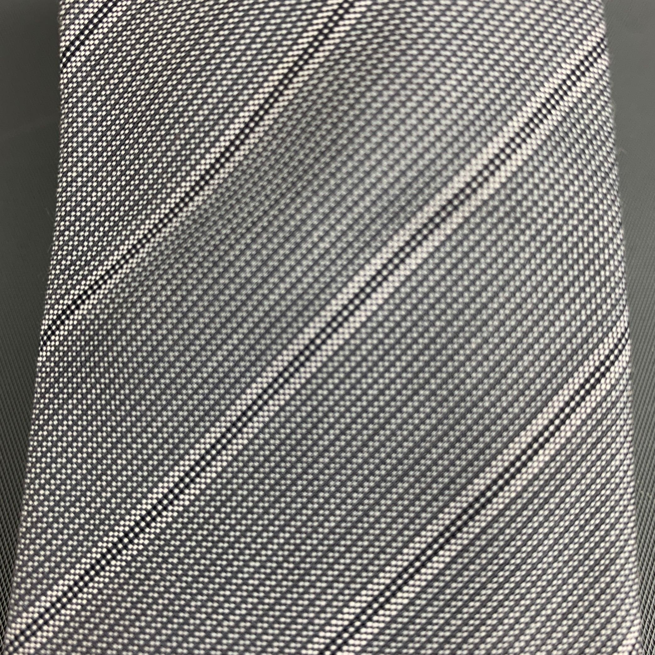 JOHN VARVATOS necktie comes in a black and grey diagonal striped cotton woven.New with Tags. 

Measurements: 
  Width: 3 inches Length: 56 inches  

  
  
 
Sui Generis Reference: 129650
Category: Tie
More Details
    
Brand:  JOHN VARVATOS
Color: 