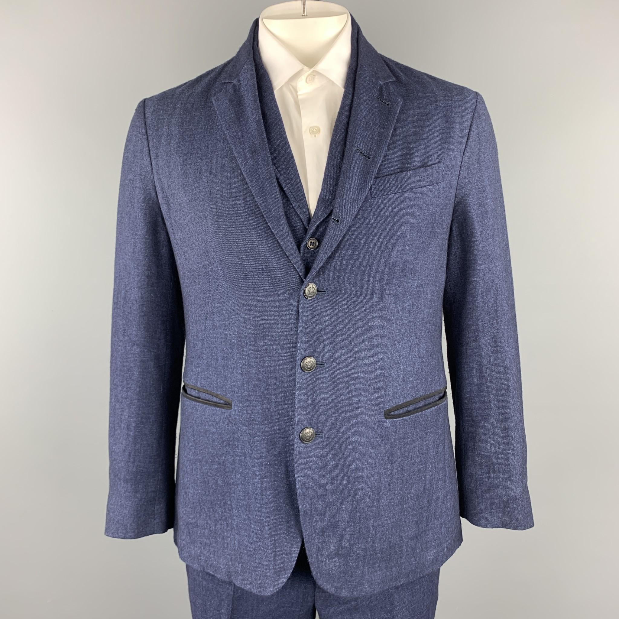 Retailed at $1,200.00. JOHN VARVATOS suit comes in blue textured linen / wool and includes a single breasted, three - six embossed button sport coat with a notch lapel and a matching vest and flat front trousers. 

Excellent Pre-Owned