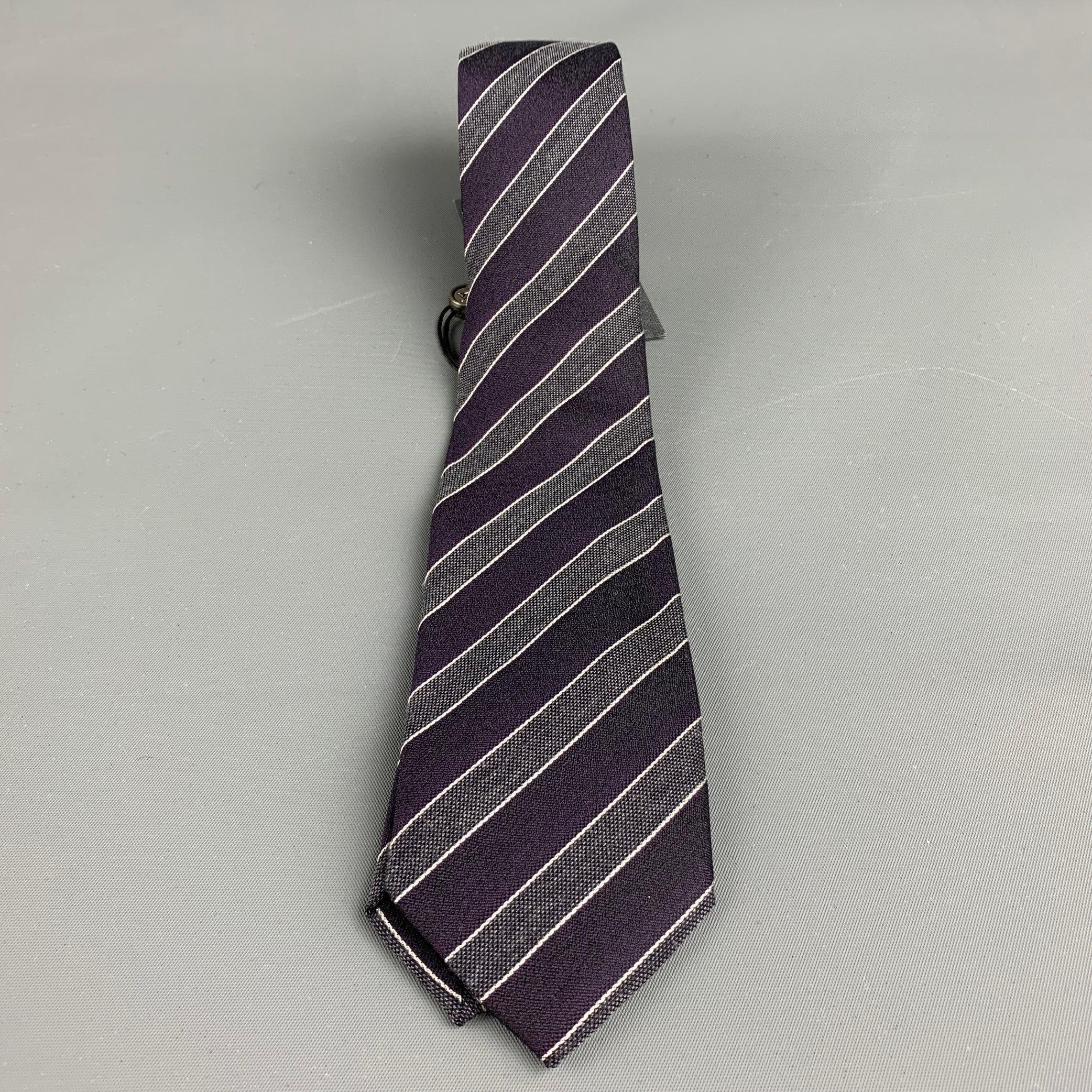 JOHN VARVATOS necktie comes in a purple and silver striped silk woven. Hand Made.New with Tags. 

Measurements: 
  Width: 3 inches Length: 58 inches  

  
  
 
Sui Generis Reference: 129648
Category: Tie
More Details
    
Brand:  JOHN