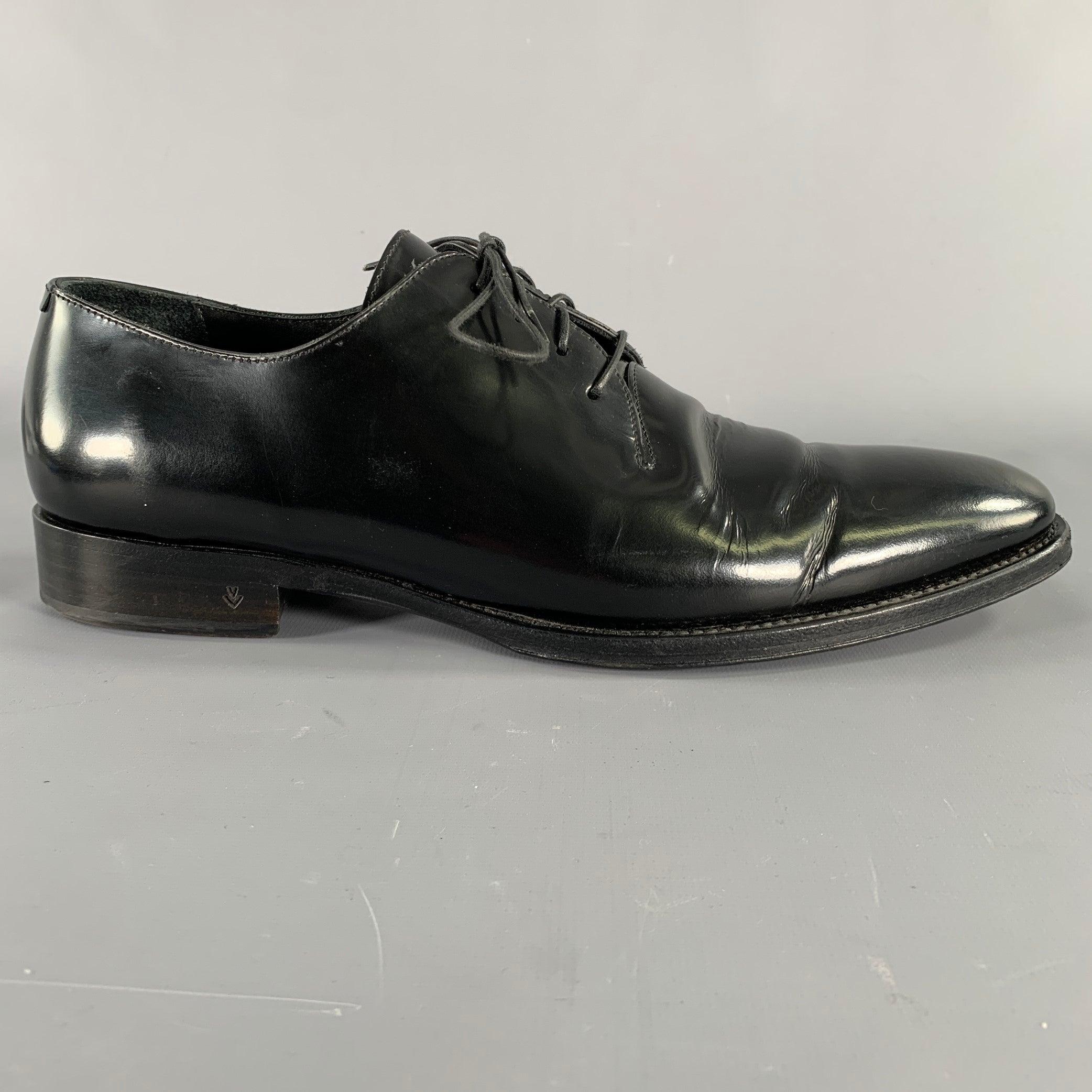 JOHN VARVATOS shoes
in a black patent leather fabric featuring a derby style, and lace-up closure. Handmade in Italy.Very Good Pre-Owned Condition. Moderate creases, as is. 

Marked:   F 3832V1 Y1410 01 11Outsole:12.25 inches  x 4 inches 
  
  
