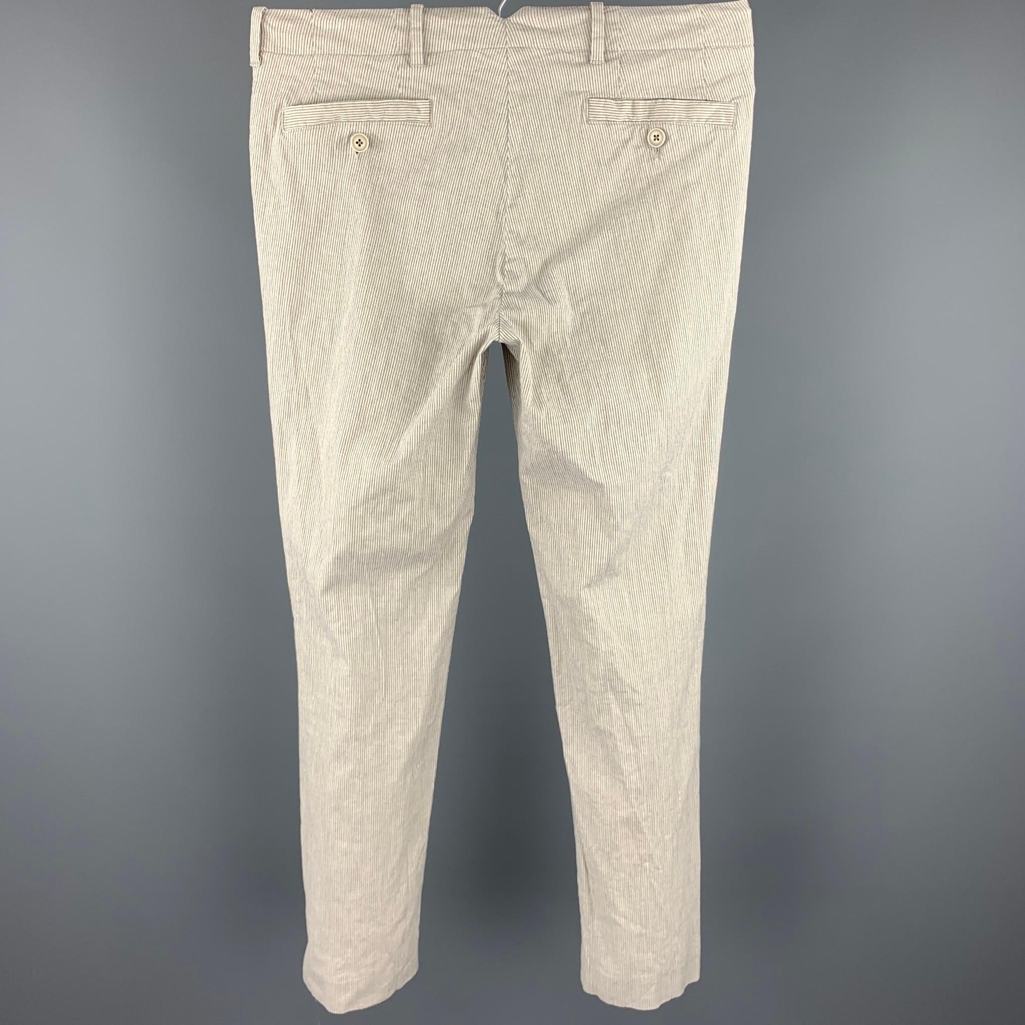 JOHN VARVATOS casual pants comes in a cream stripe cotton blend featuring a slim fit ad a zip fly closure. Made in Portugal. 

Good Pre-Owned Condition.
Marked: 44

Measurements:

Waist: 30 in. 
Rise: 8.5 in. 
Inseam: 28 in. 

SKU: 97685
Category: