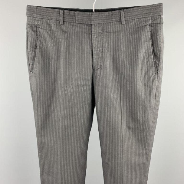JOHN VARVATOS dress pants comes in a dark gray stripe cotton featuring a flat front and a zip fly closure. Made in Portugal.Excellent
Pre-Owned Condition. 

Marked:  46 

Measurements: 
 Waist: 32 inches 
Rise: 8.5 inches 
Inseam: 30 inches 
 
 
