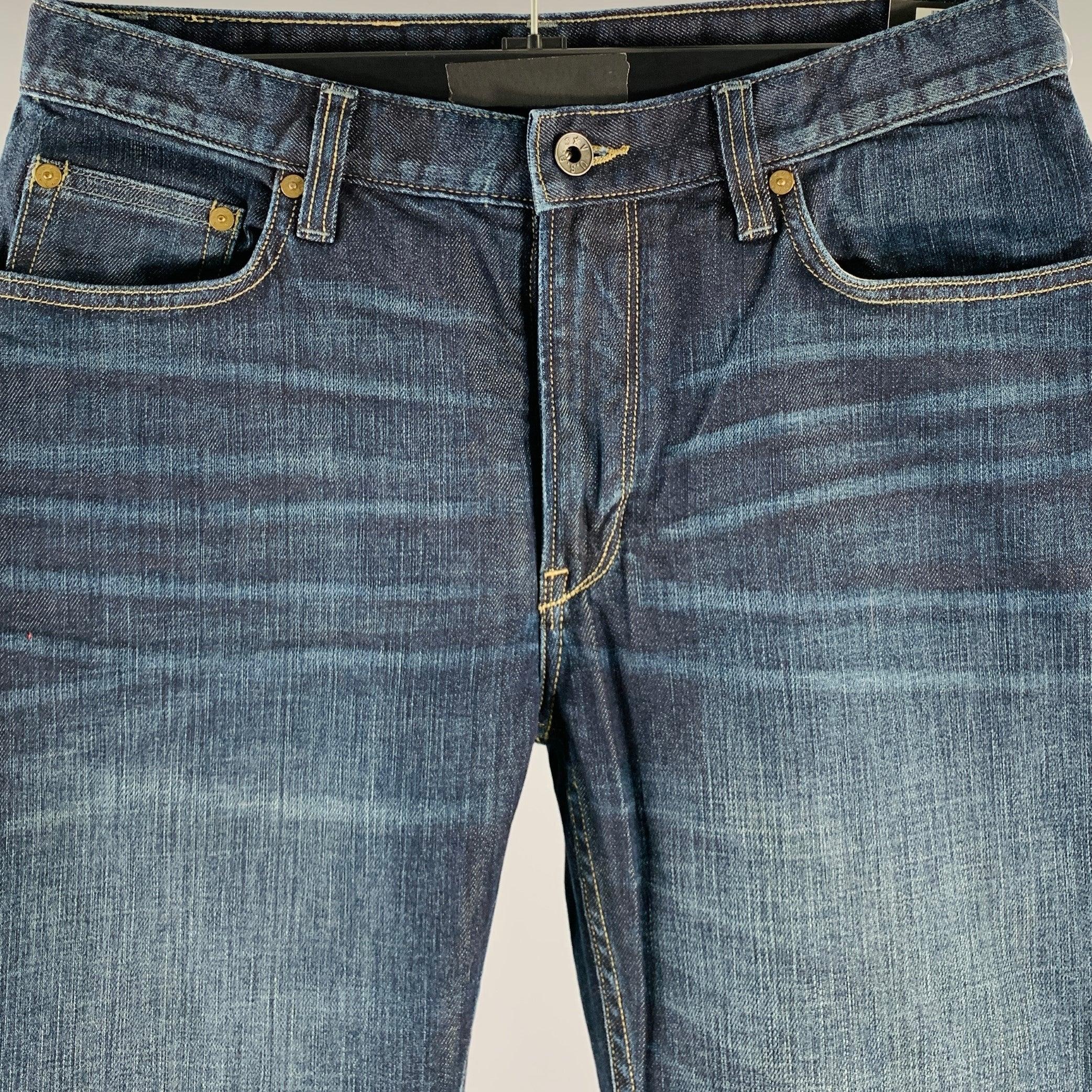 JOHN VARVATOS jeans
in a blue cotton stretch blend woven fabric featuring a straight leg, distressed design, five pockets style, and zip fly closure. Excellent Pre-Owned Condition. 

Marked:   32R 

Measurements: 
  Waist: 32 inches Rise: 8.5 inches