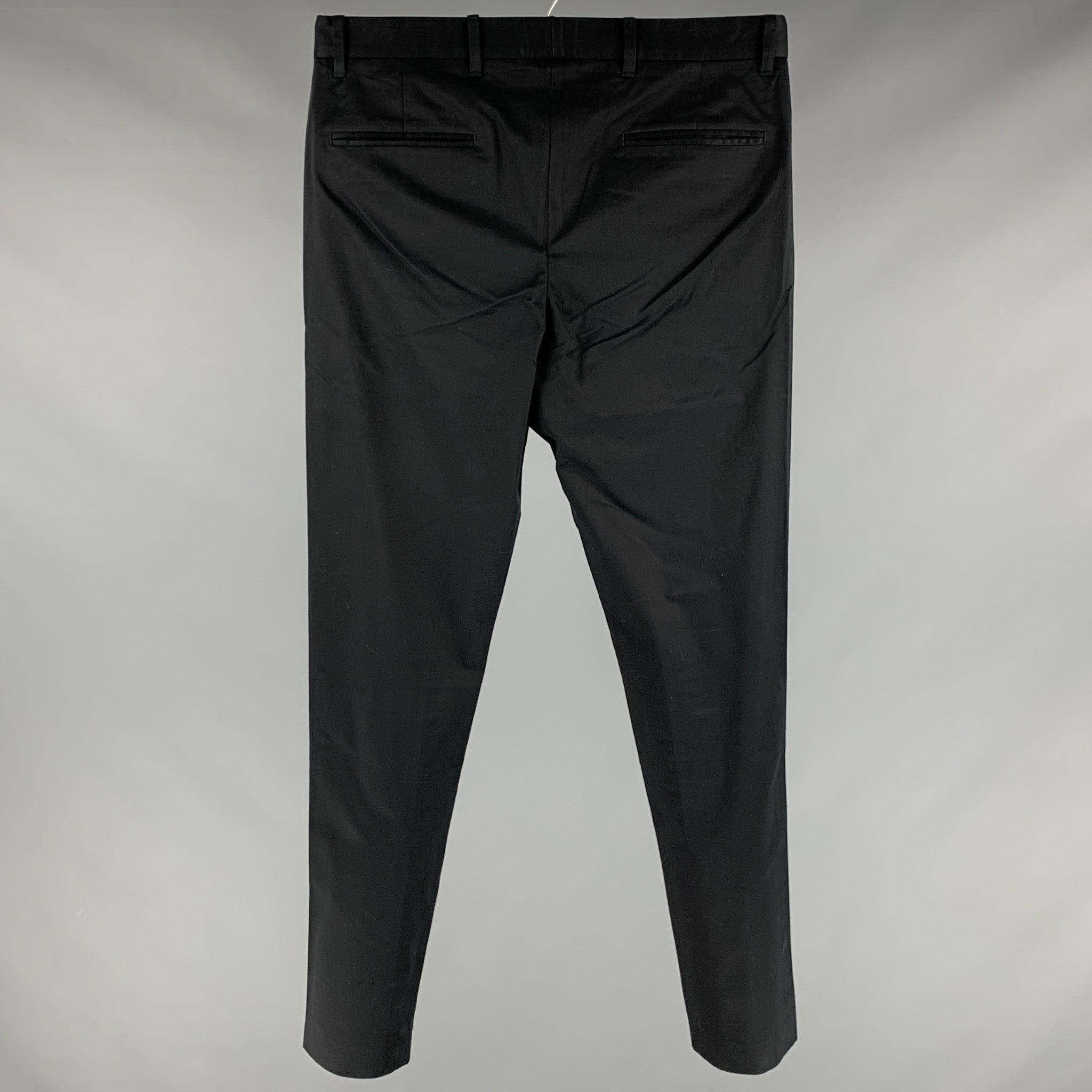 JOHN VARVATOS casual pants
in a black cotton blend featuring flat front style, and zip fly closure. This item has been altered.Excellent Pre-Owned Condition. 

Marked:   46 

Measurements: 
  Waist: 33 inches Rise: 9 inches Inseam: 32 inches Leg